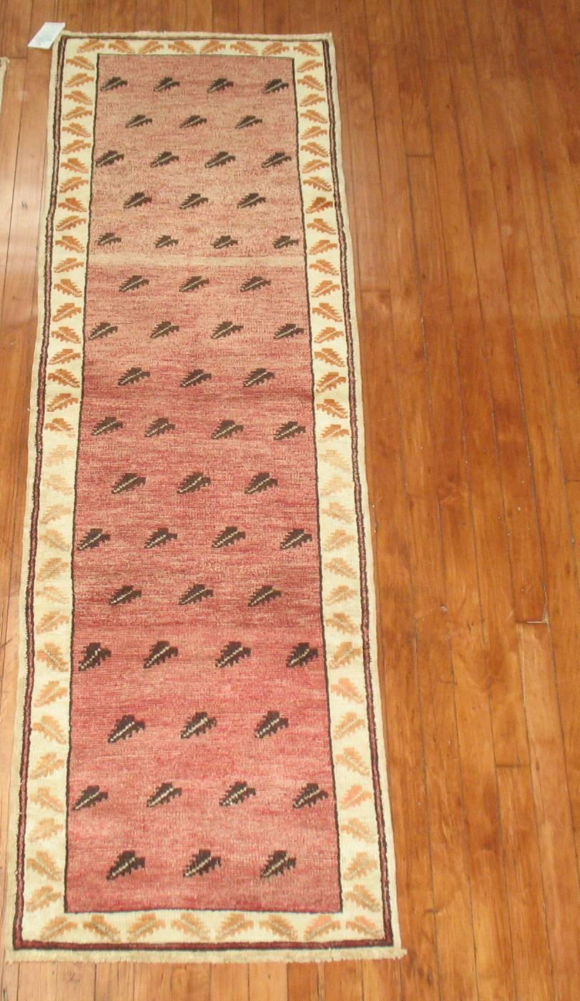 Pair of short vintage Turkish Anatolian runners with matching floral designs.

Measuring: 2'1