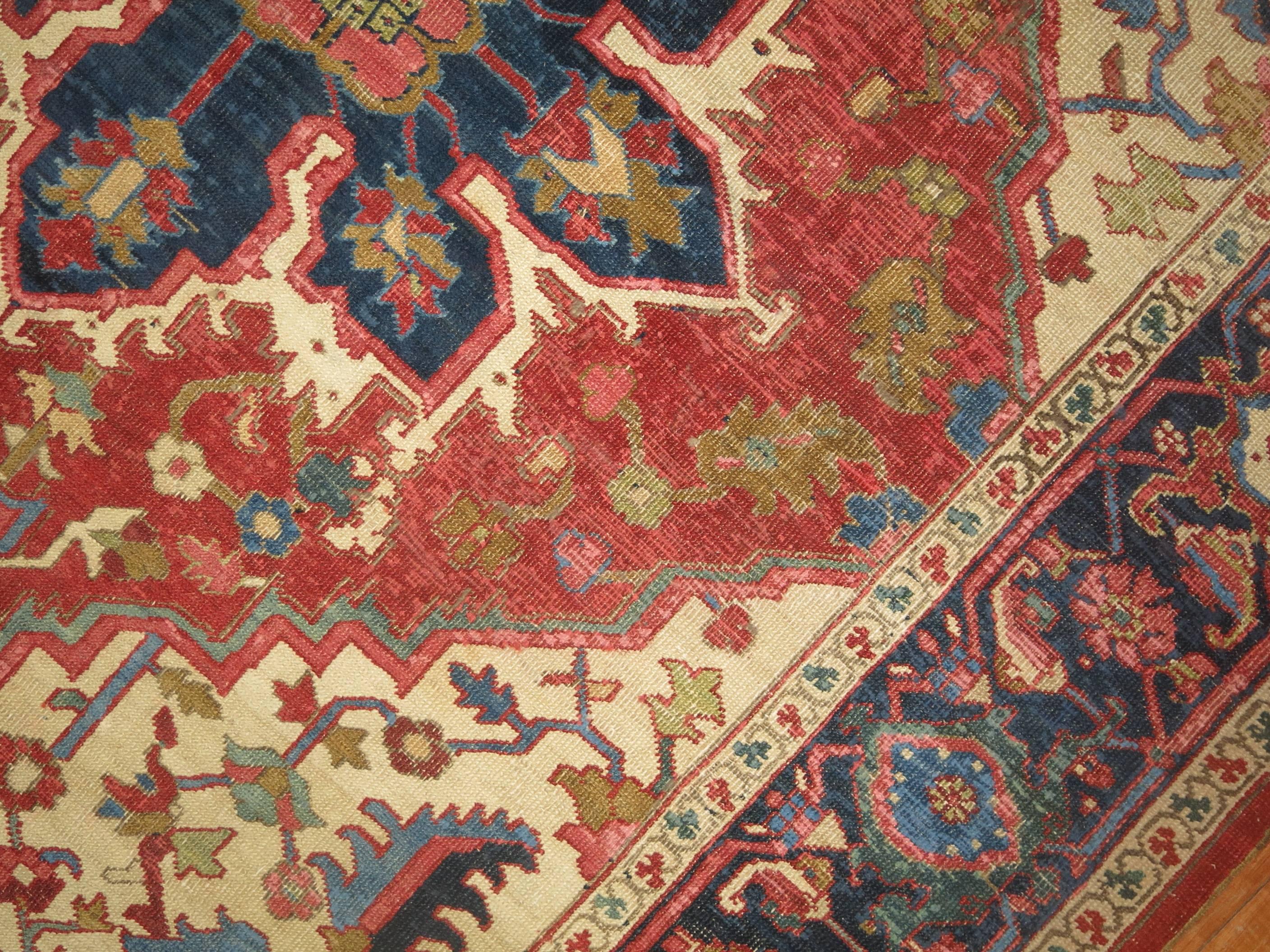 Rare square size Persian Serapi rug.