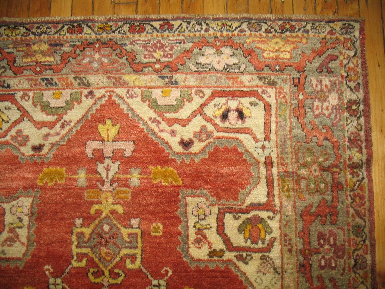 Vintage Turkish Oushak rug featuring silver colored accents.