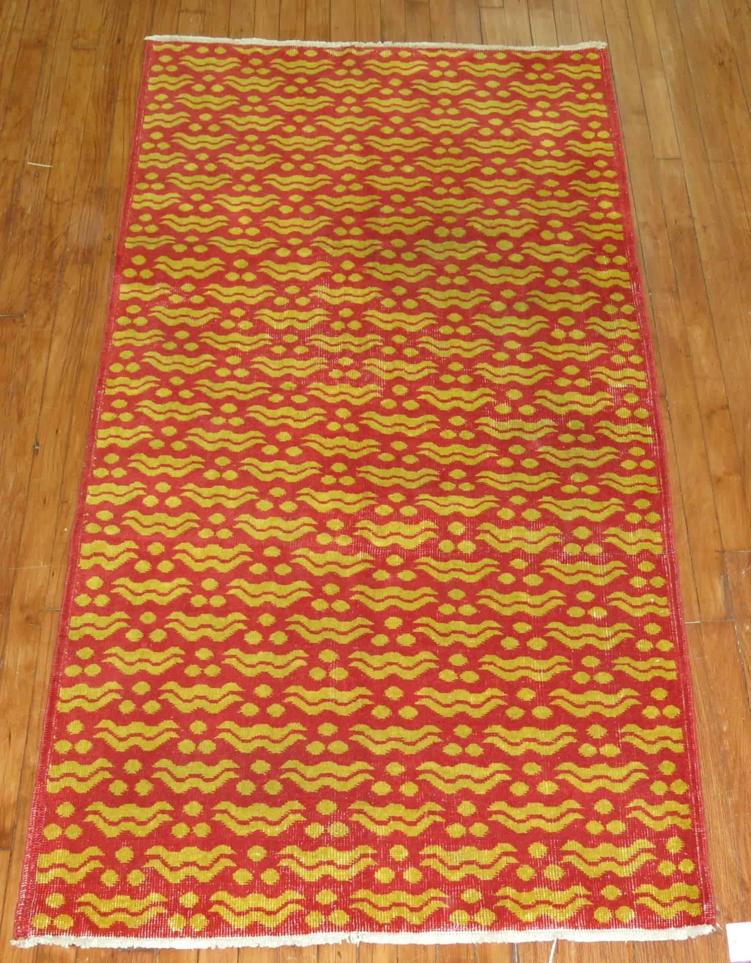 Bright red and yellow vintage Turkish rug with a 