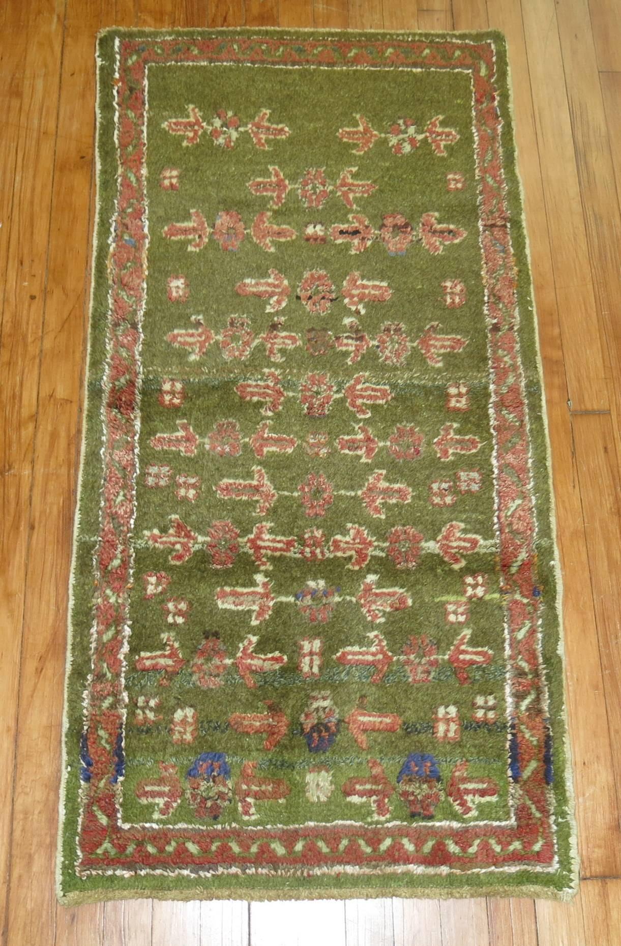 Small vintage Turkish Oushak rug in a rare army green color,

circa 1930. Measures: 2'2