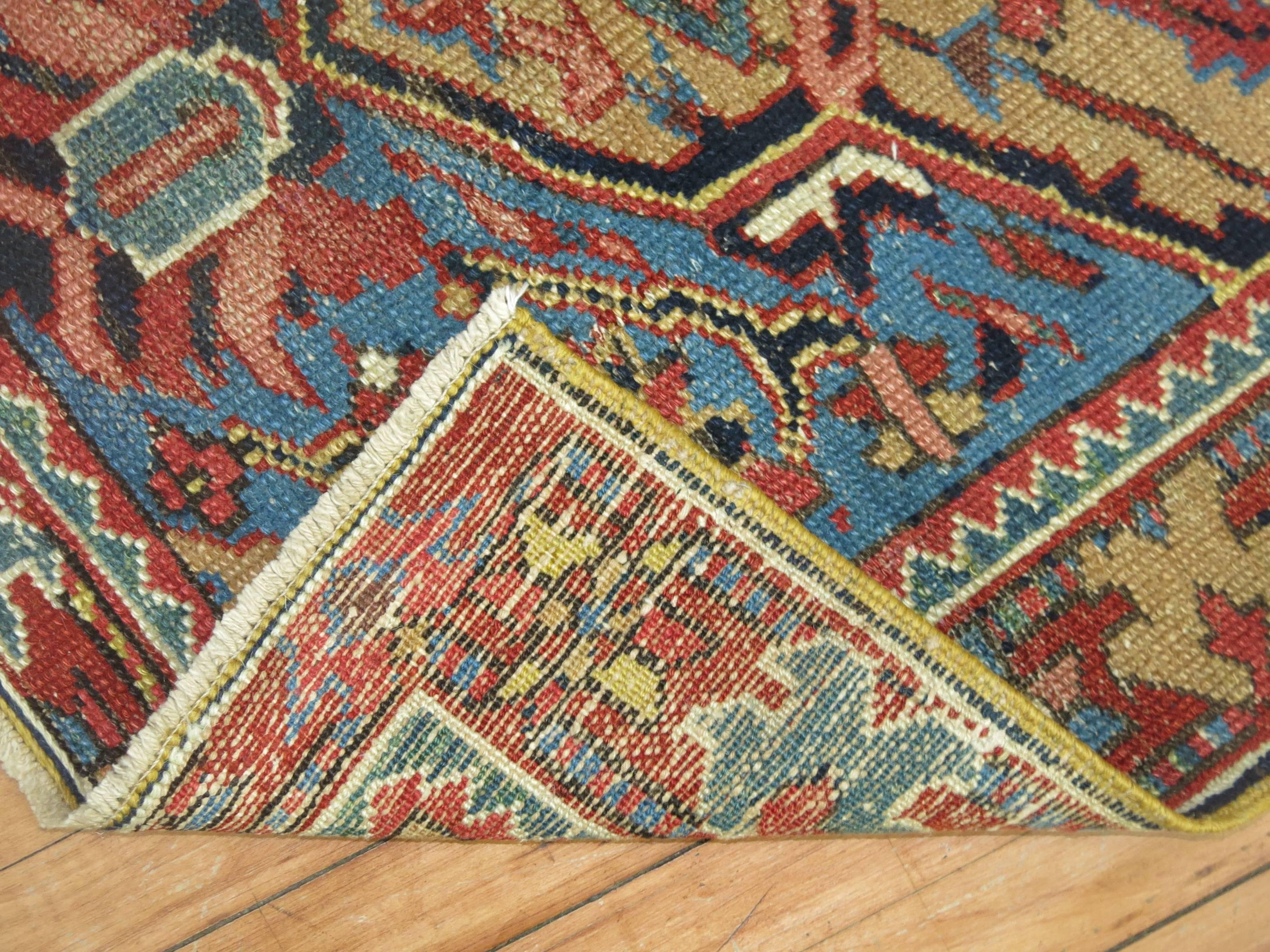 Scatter size antique Persian Heriz rug.