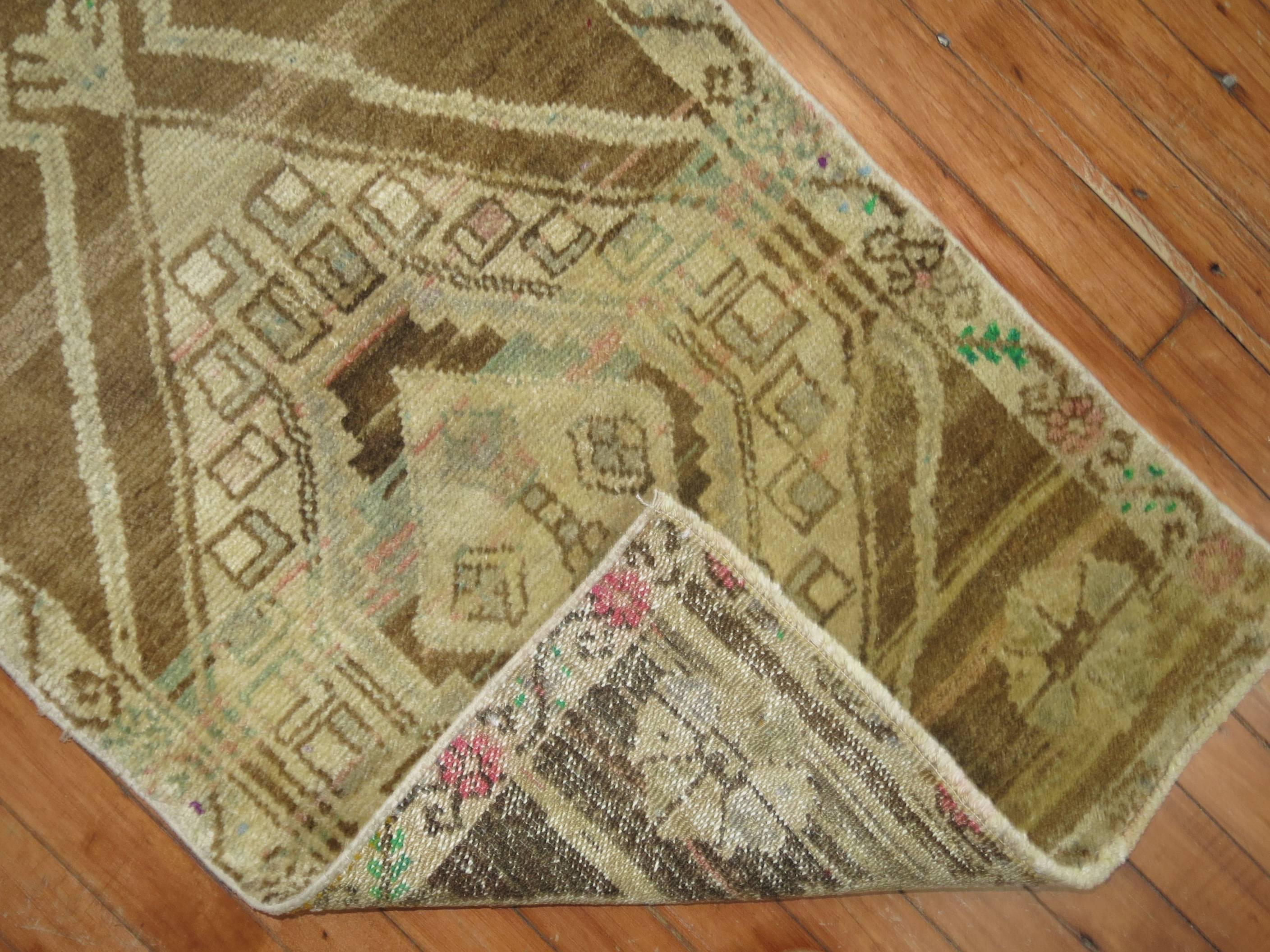 Quirky Turkish Anatolian with off center medallion on a soft brown colored ground with apple green cotton highlights.