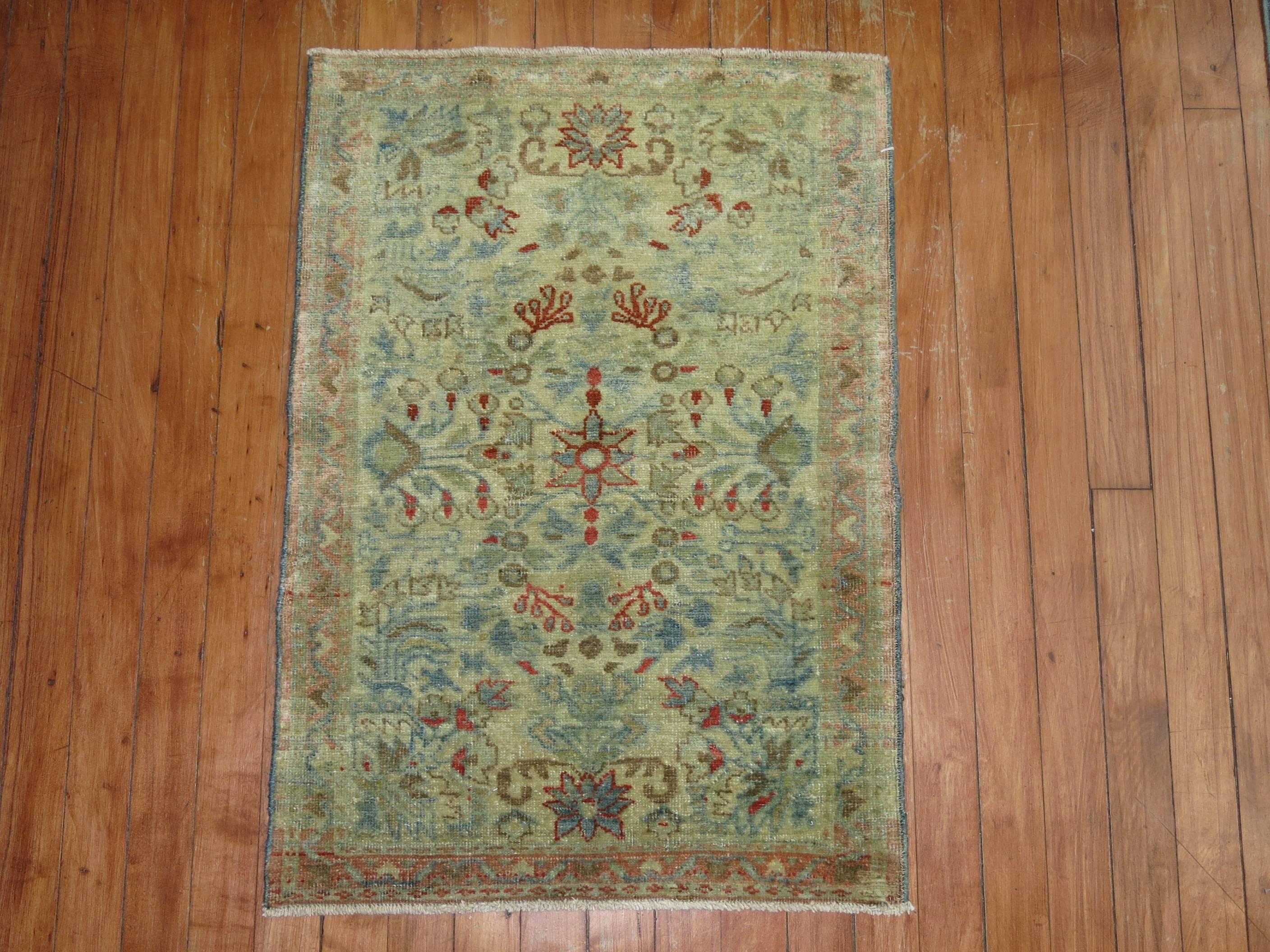 An early 20th century Persian rug mat in sea foam colors

1'10'' x 2'8''