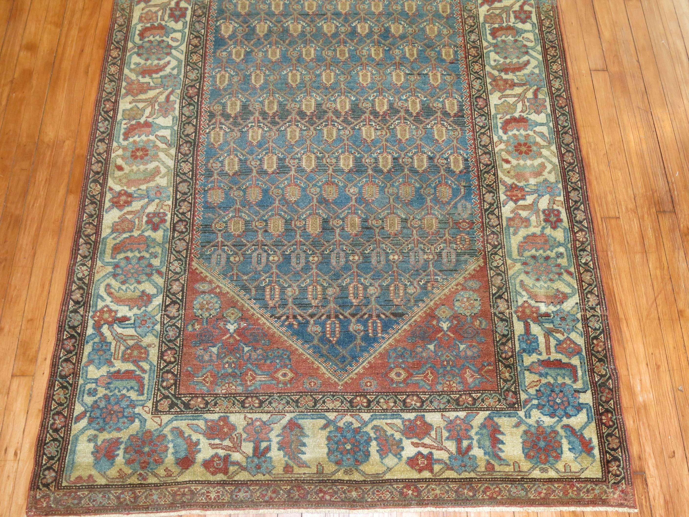 An early 20th century one of a kind Persian Malayer in predominant blues and rust tones

Size: 4'11