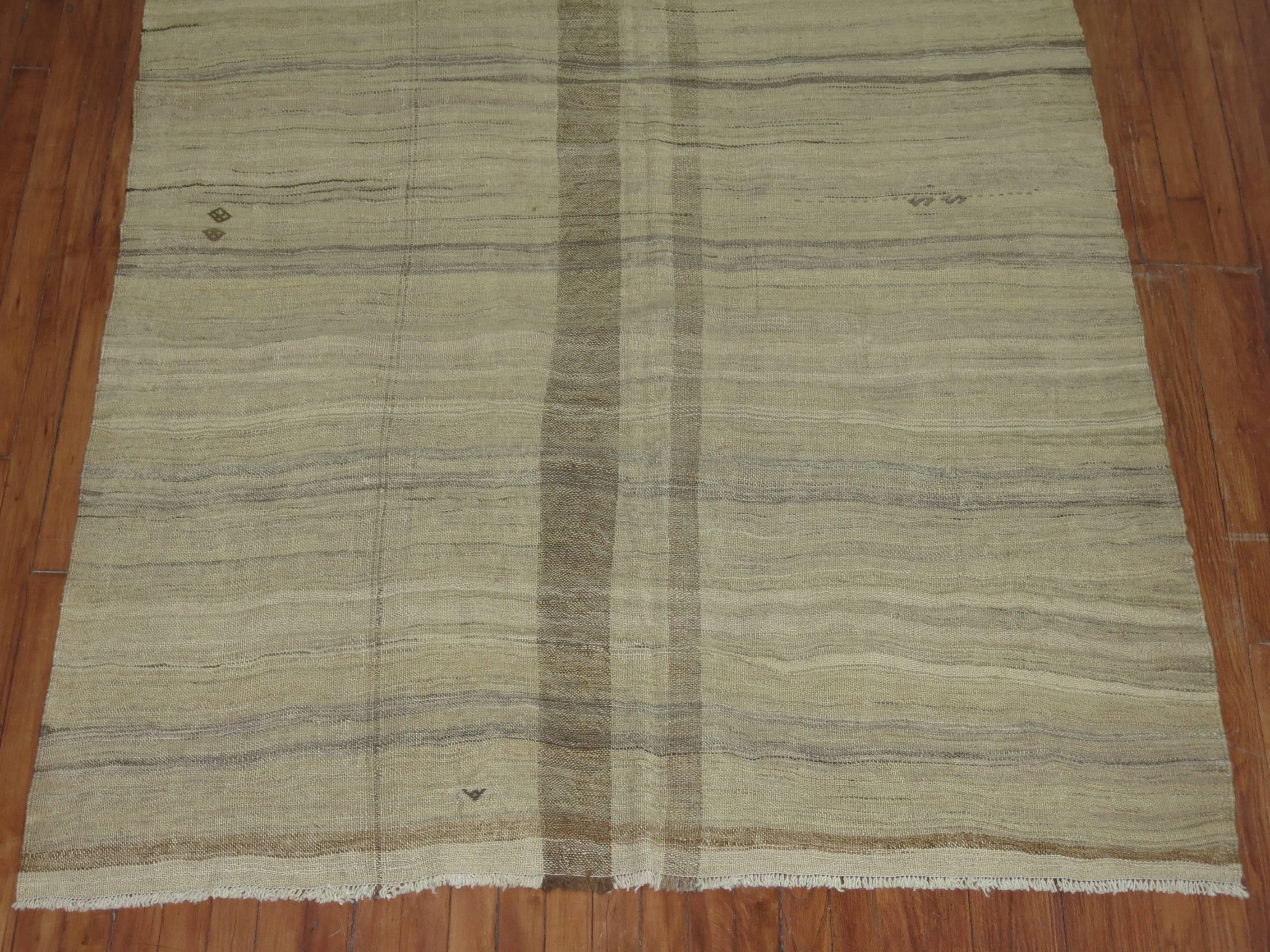 One of a kind vintage Kilim in khaki and brown accents from the mid-20th century.

Measures: 5' x 8'9