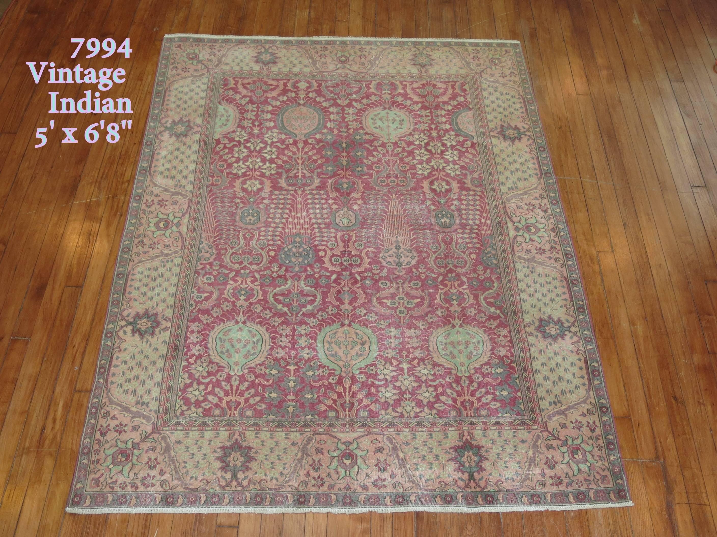 Vintage Indian Lahore rug predominantly in pink. Mint green, gray and pink accents

Size: 5' x 6'8