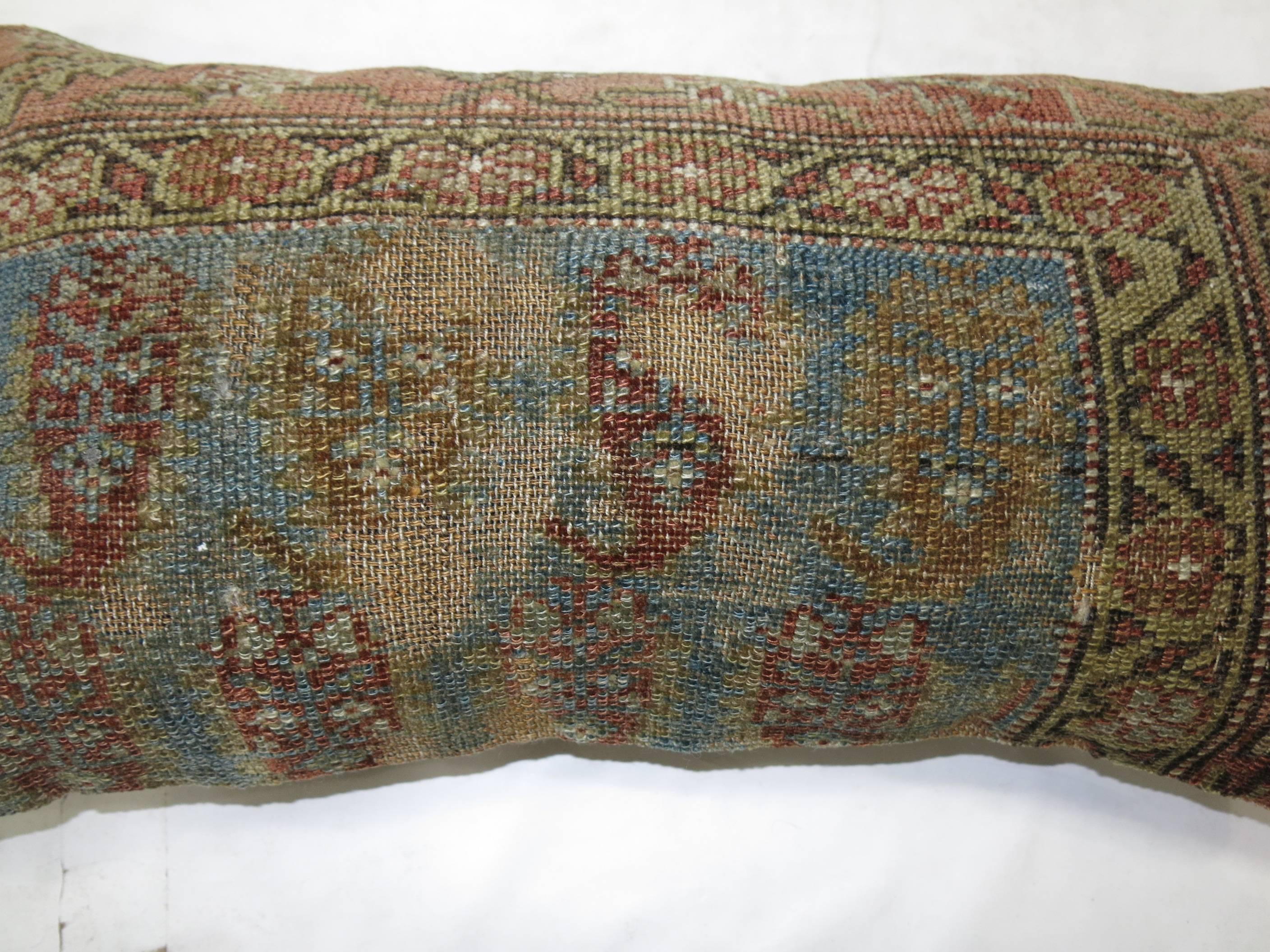 Bolster size pillow made from an antique Persian Malayer rug. zipper closure and polyfill insert included

14'' x 26''