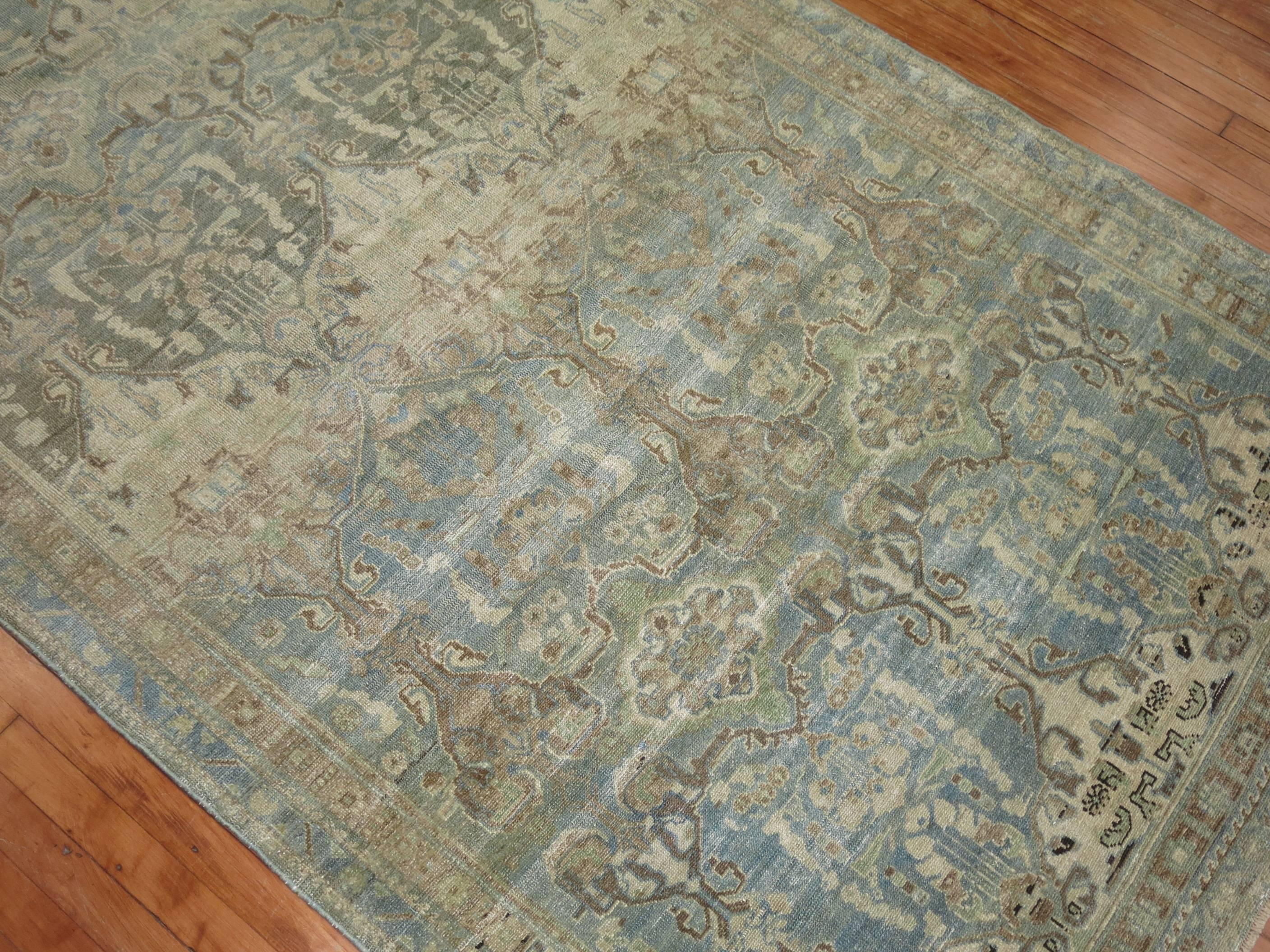 An early 20th century Persian Malayer in predominant pale blues, green and brown.


Antique Malayer rugs are unique in the diversity of design and color that is somewhat different than other antique Persian rugs. They come in different designs