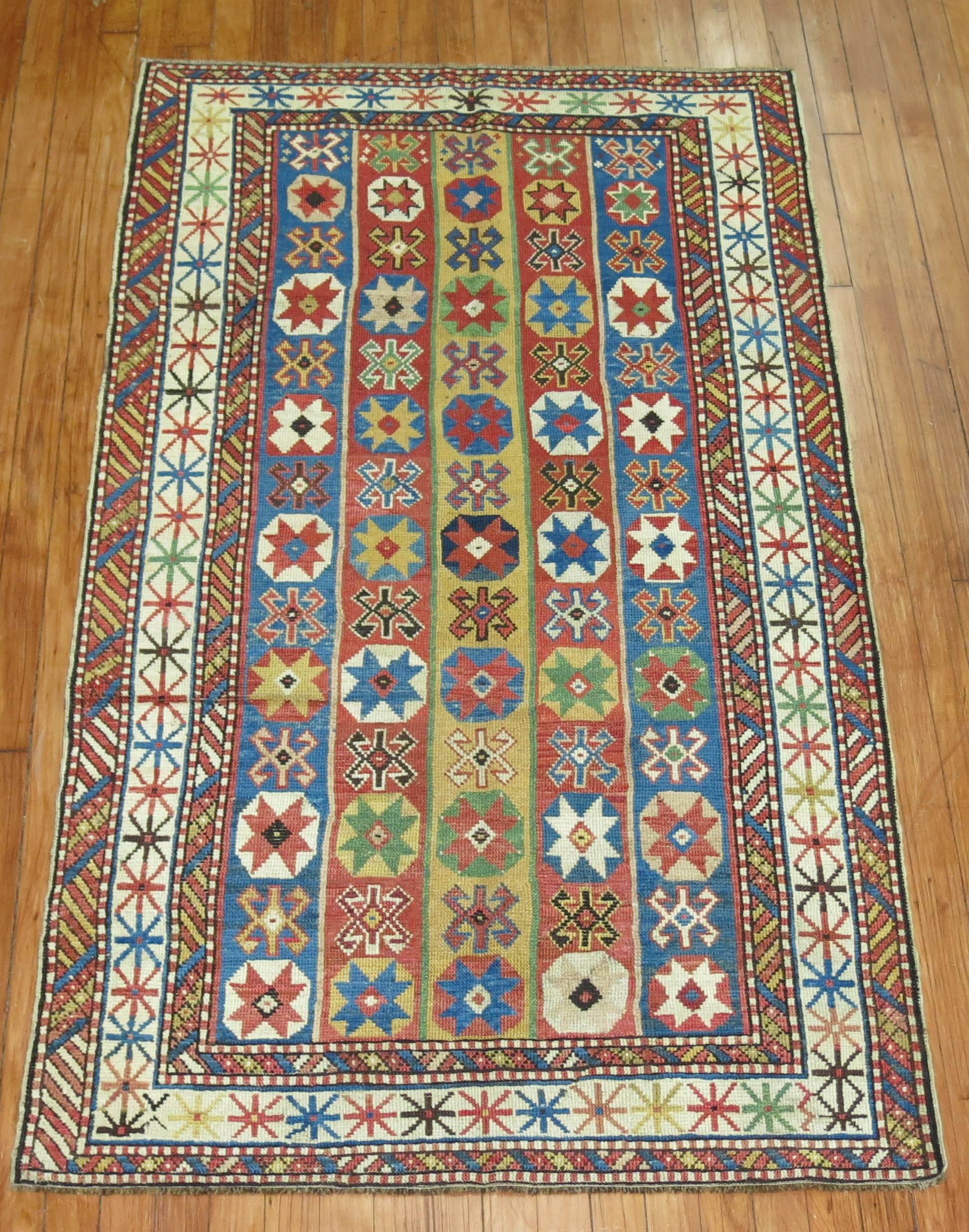 An early 20th century decorative caliber colorful Caucasian rug. Vivid colors highlighted by sky blue and chartreuse,

circa 1910. Measures: 3'4'' x 5'9''.