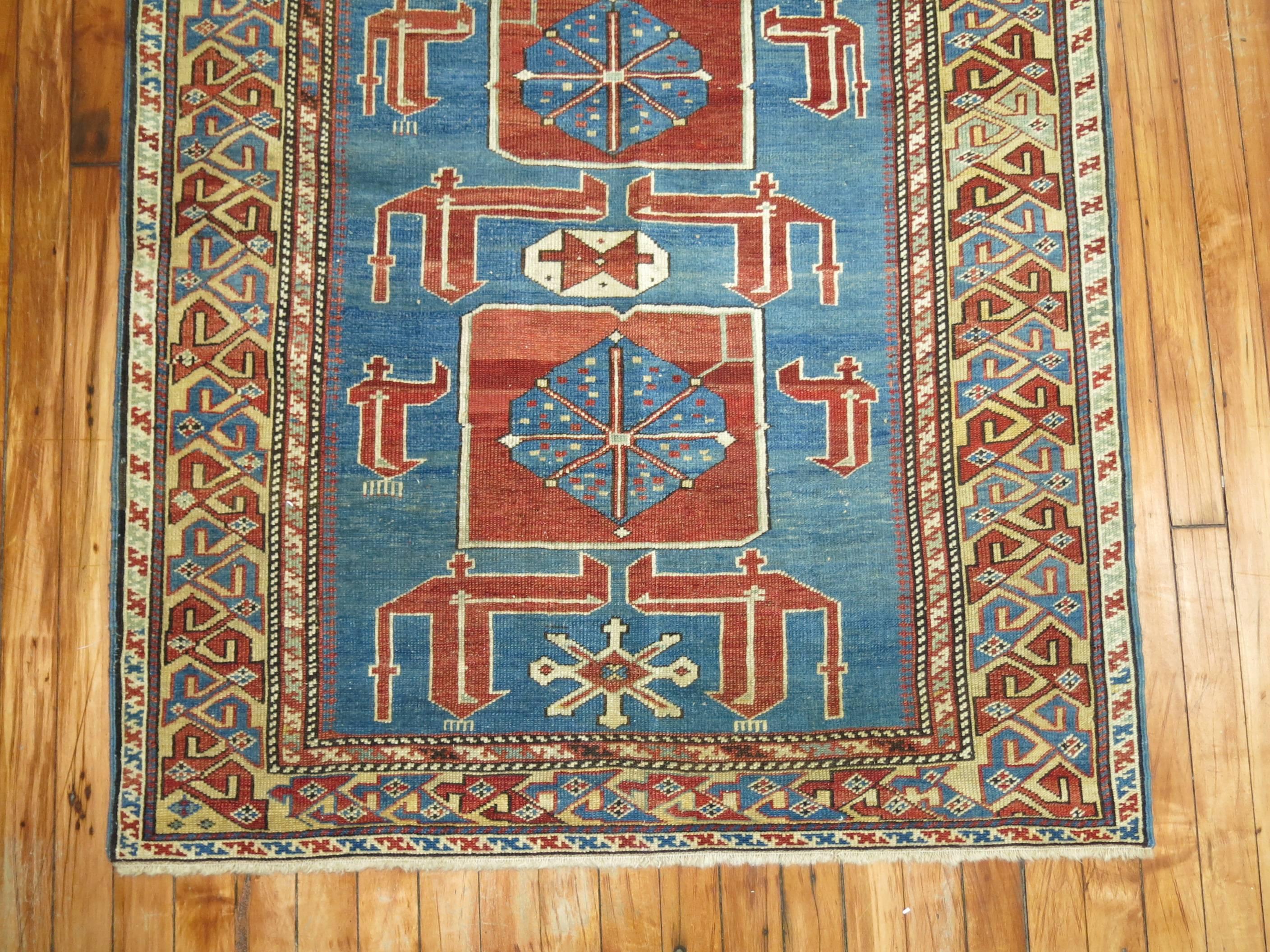 A turn of the 20th century finely woven antique Karaghasli Caucasian rug.

The brilliant colors and use of lateral elements make this a unique addition to any collection. These carpets were introduced into Russian hands by the market demand