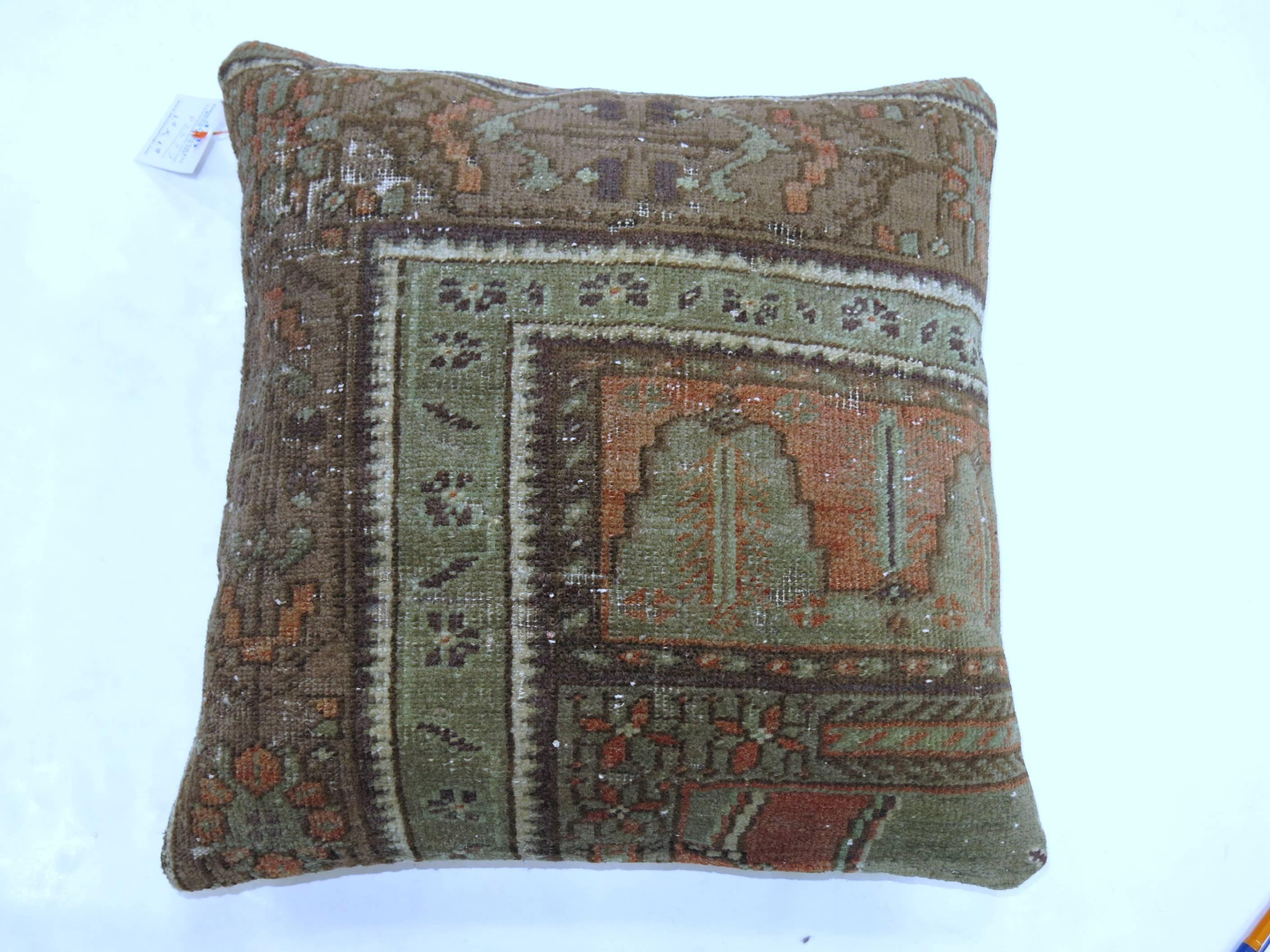 Two pillows from a earth toned Turkish Oushak rug.
