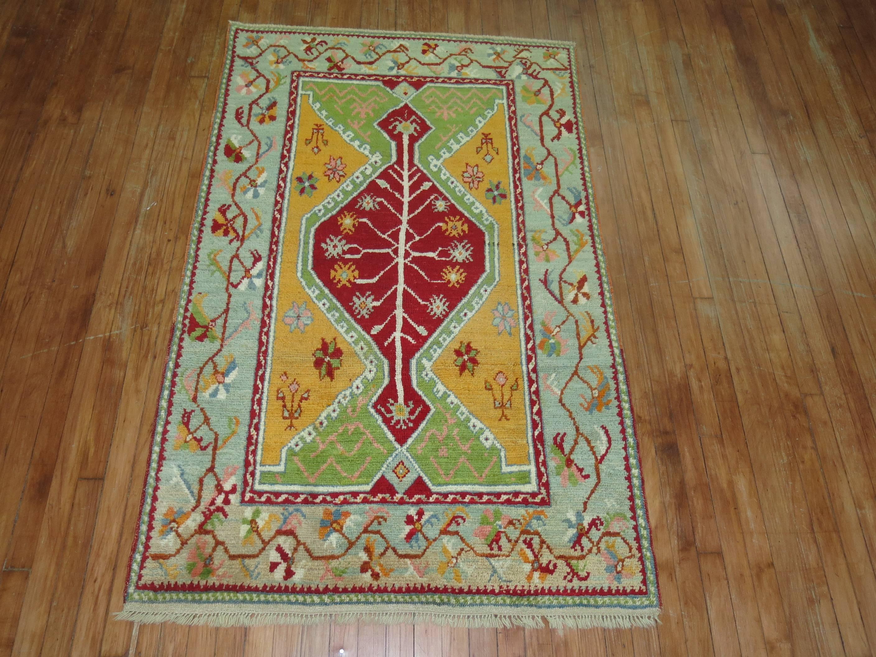 Accent size Turkish Ghiordes rug featuring bright vibrant colors.

Measures: 3'9'' x 6'.