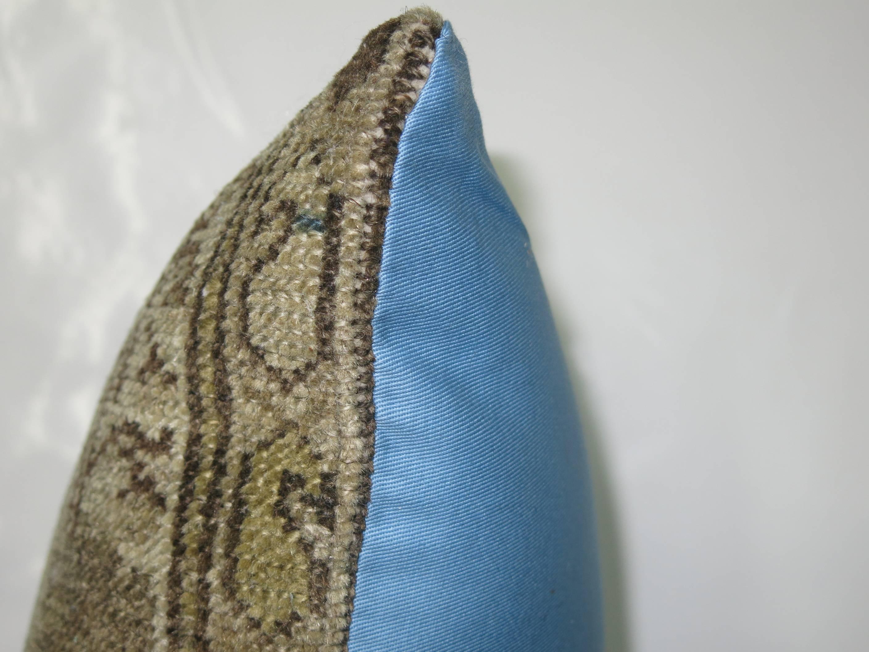 Pillow made from an antique Persian Malayer rug in blue and khaki, backed in soft blue color cotton.