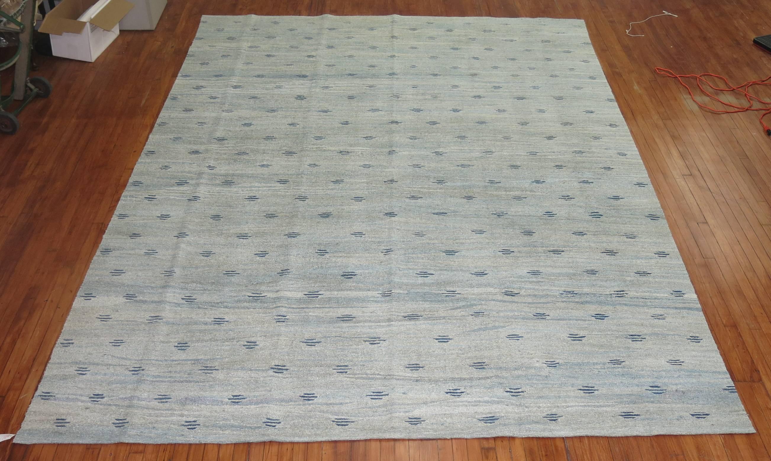 A late 20th century Swedish influenced Turkish flat-weave with a wavy small repetitive motif in soft blues.