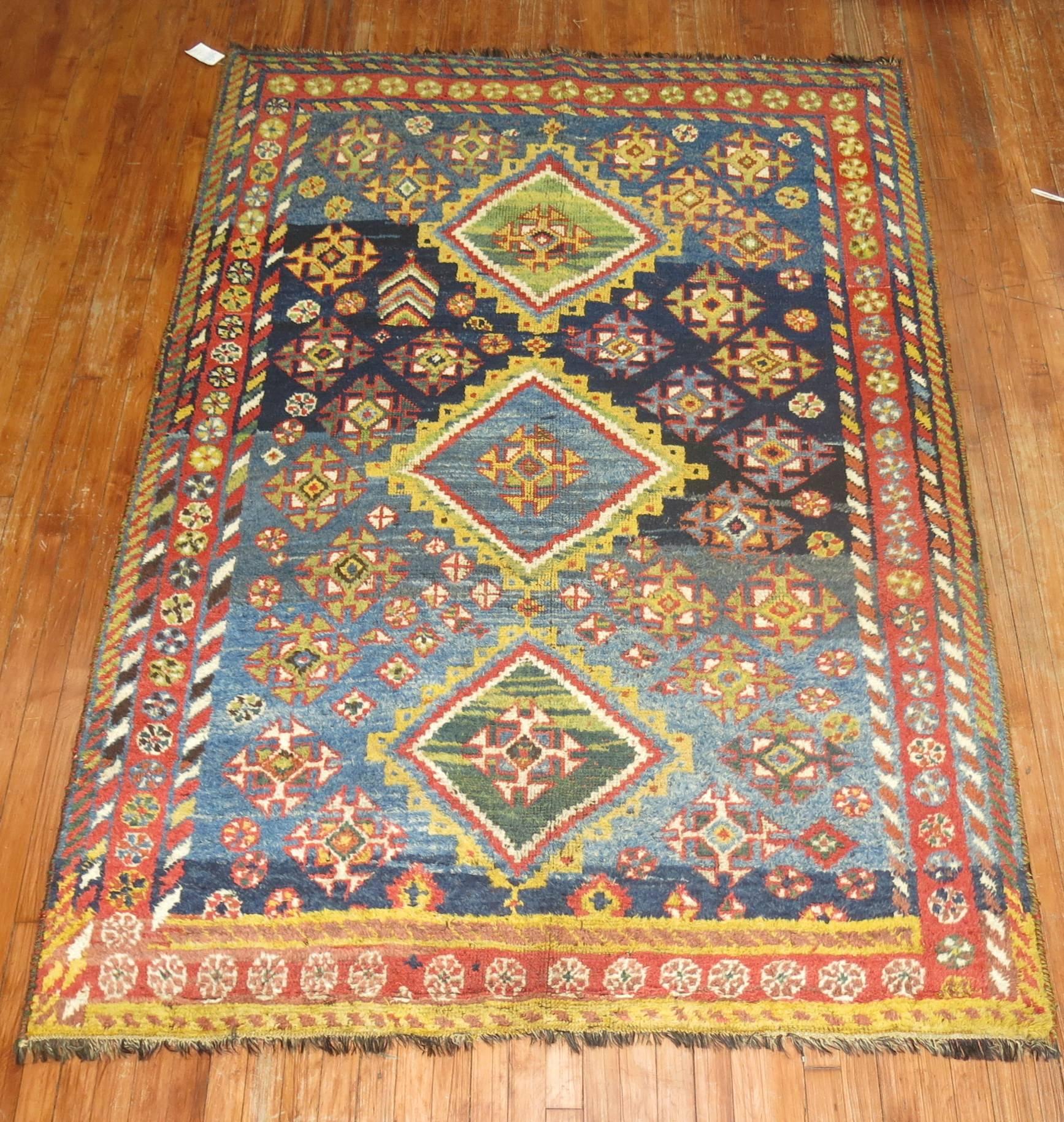 A colorful one of a kind antique Persian Gabbeh rug from the 2nd quarter of the 20th century.

Measures: 5'5'' x 7'7''.

Persian Gabbeh rugs are made with extra high pile and very simple, graphic designs focused on the use of color, which tend