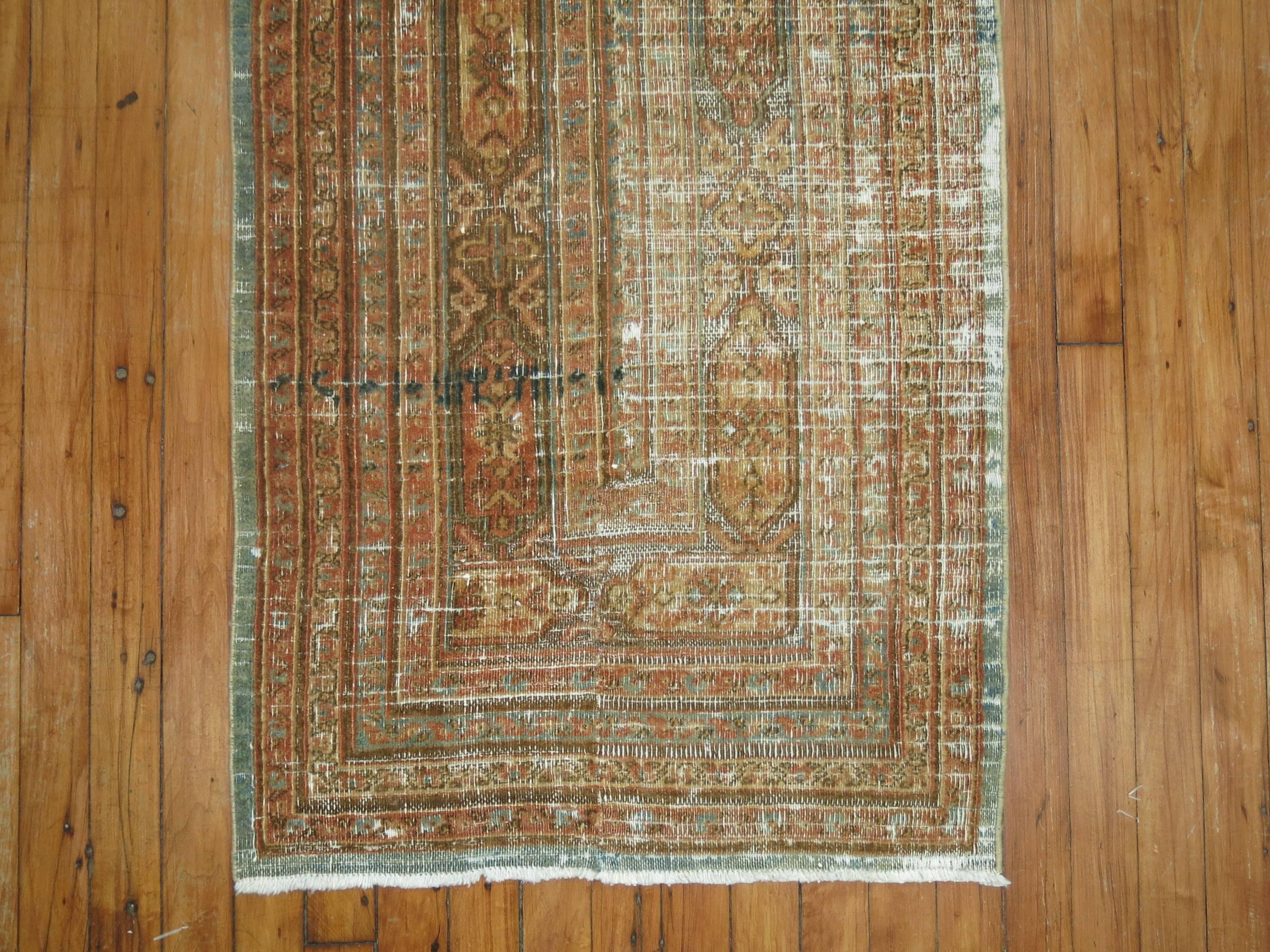 Perfectly worn and distressed early 20th century Persian narrow runner.