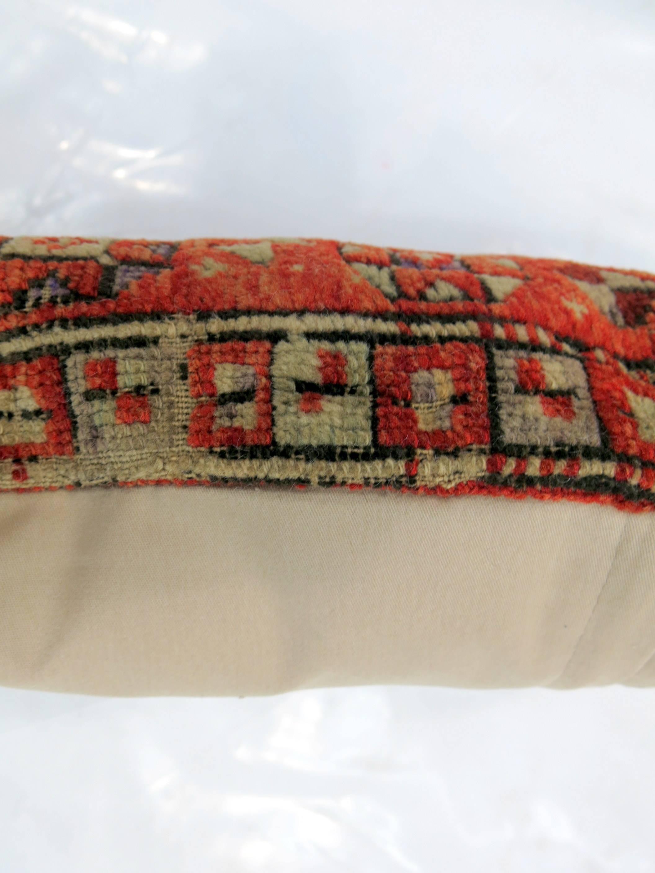 Pillow made from an orange color mid 20th century Turkish Anatolian rug.

12'' x 20