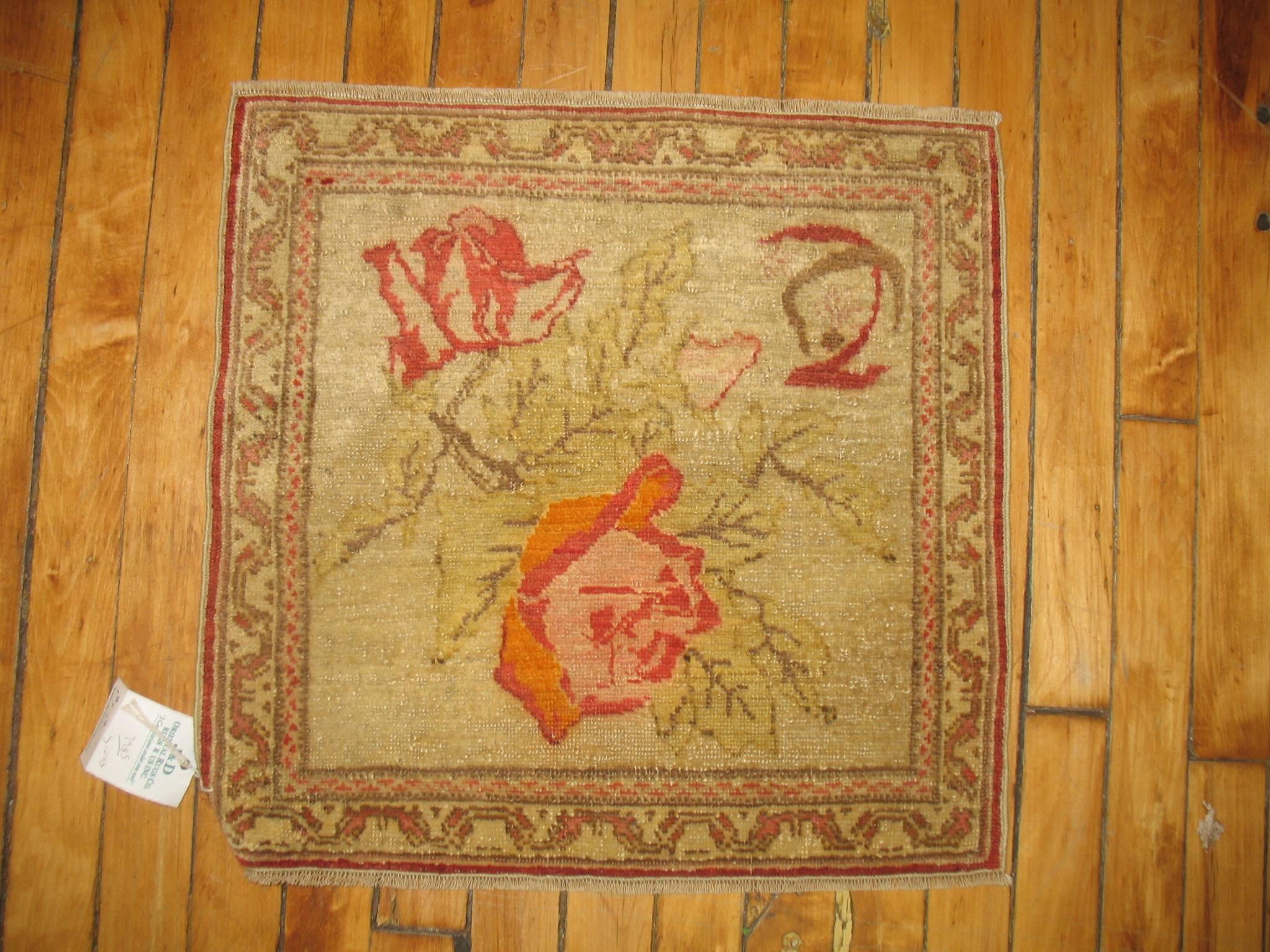 A fine Turkish rug mat with a flower motif.

Measures: 19