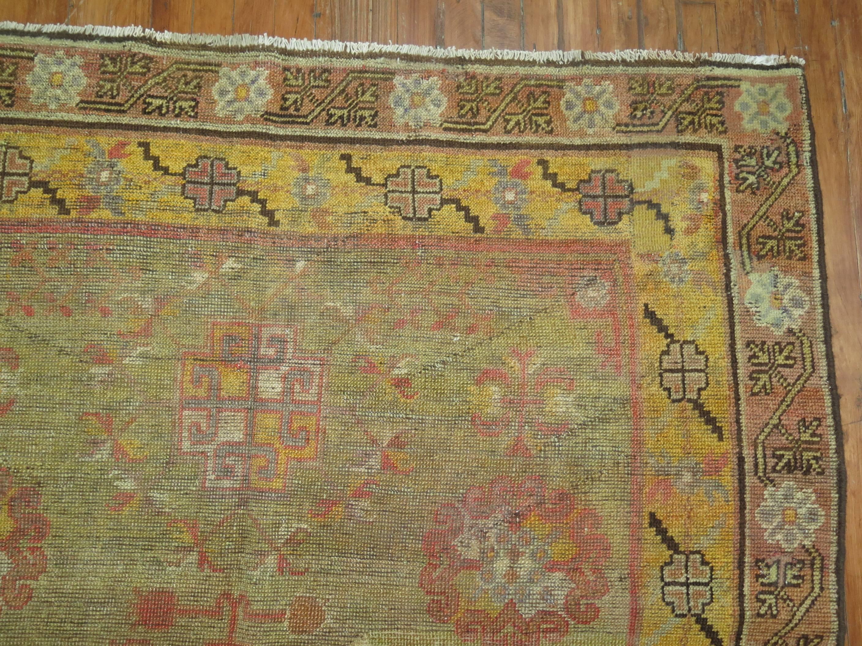 Hand-Knotted Green 19th Century Antique Wool Khotan Rug For Sale