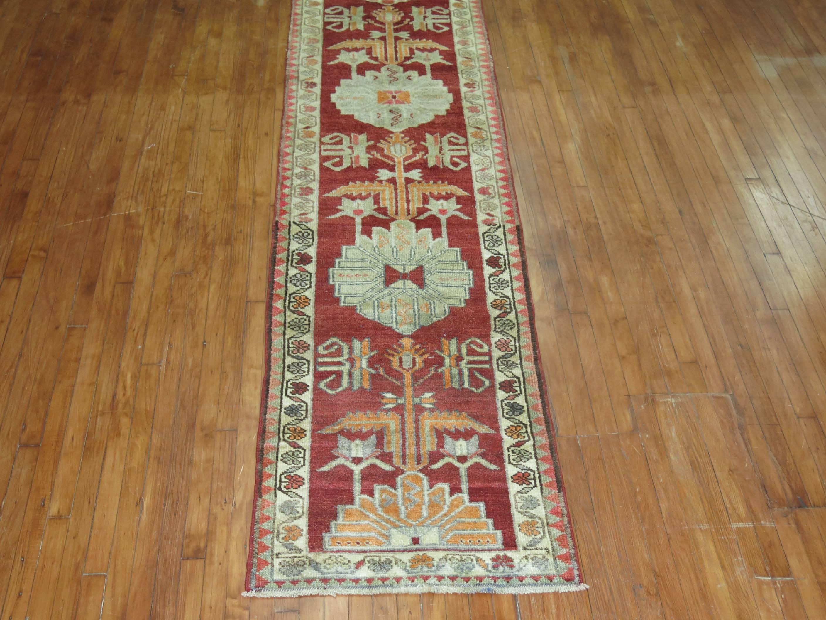 Narrow and long vintage Turkish Anatolian runner in a deep red tone

2'9'' x 13'7''