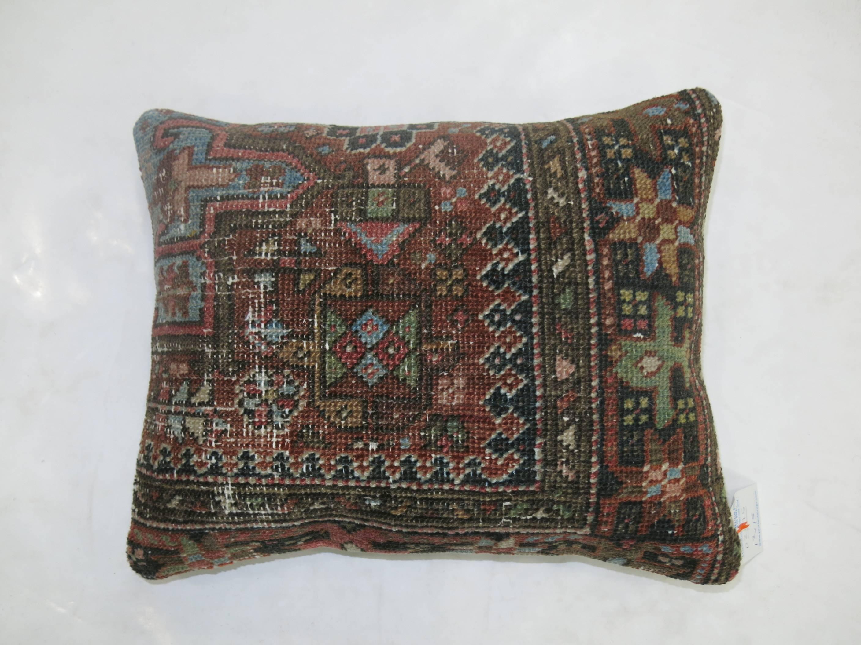 Complimentary set of antique Persian Heriz pillows. Measure: 14'' x 17'' and 17'' x 18''.