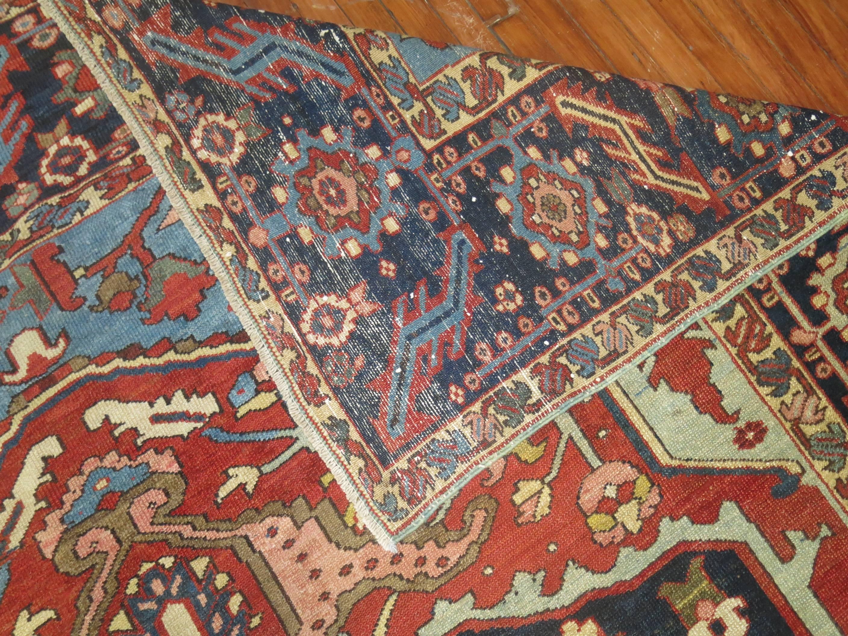 A room size masculine antique Persian Heriz rug from the 1st quarter of the 20th century

Measures: 8'8'' x 12'2''

Originating in Northwest Persia and the Iranian province of East Azerbaijan, Heriz Oriental rugs from Persia include regional