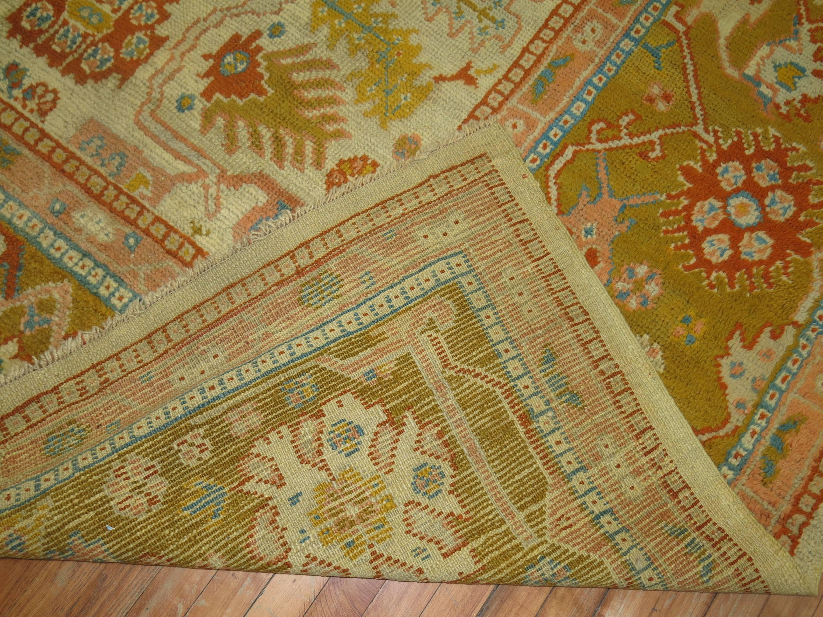 An early 20th century excellent condition all-over large scale design colorful Turkish Oushak rug. Images seen are from dark and light side so you can see full extent colors and detail from both directions.

Measures: 14' x 16'1''

Oushak rugs