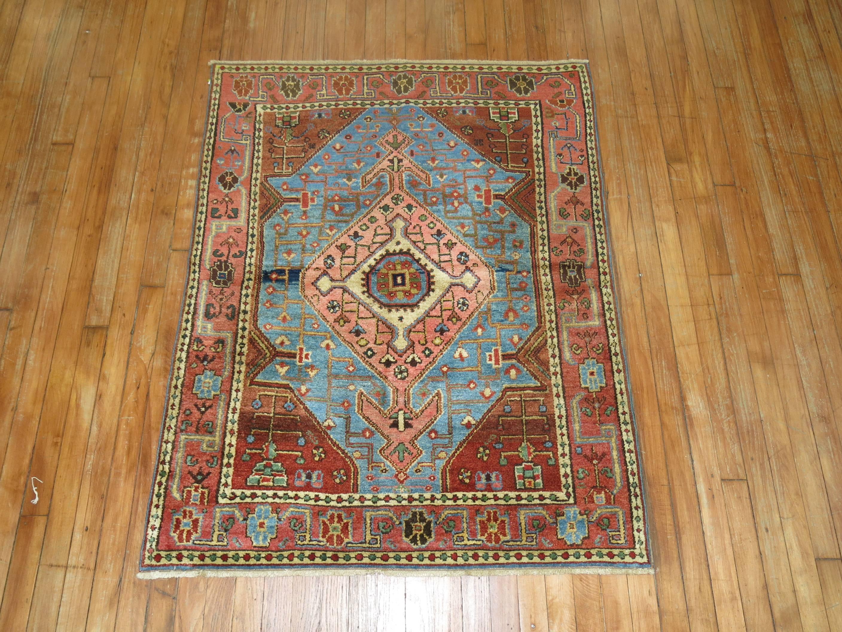 Pretty vintage decorative Persian rug from Hamadan village located in northwest Persian. Nice sky blue, rust and pink tones too. A nice contrast of colors and balance on a traditional motif, circa 1930.

Measures: 3'5' x 4'5”.