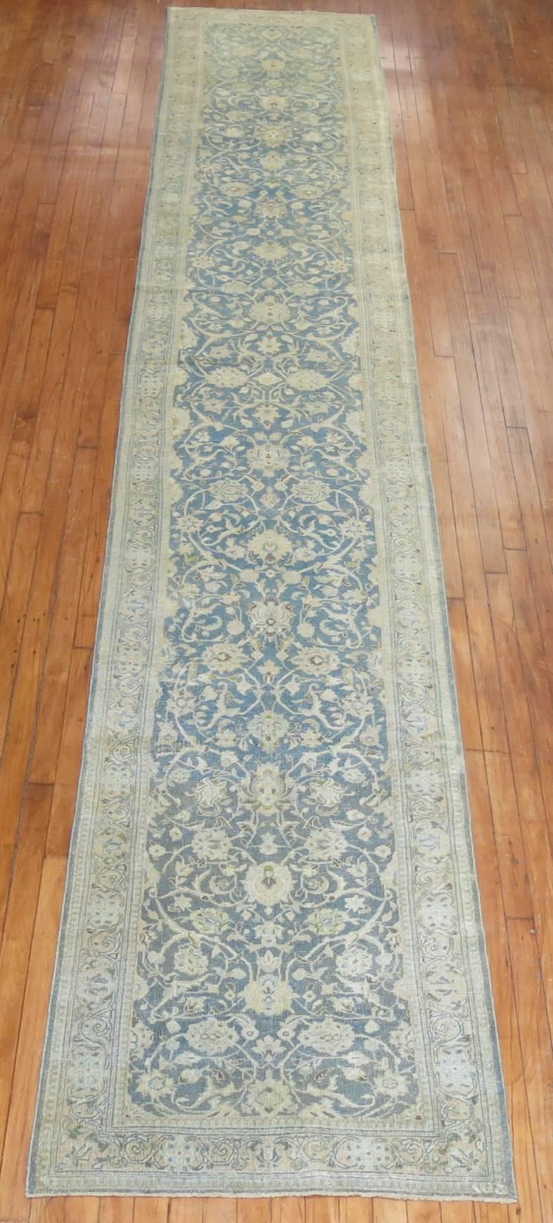 Mid-20th century Persian runner with a seafoam field and accents in mustard and sand.

Measures: 2'8'' x 17'7''.