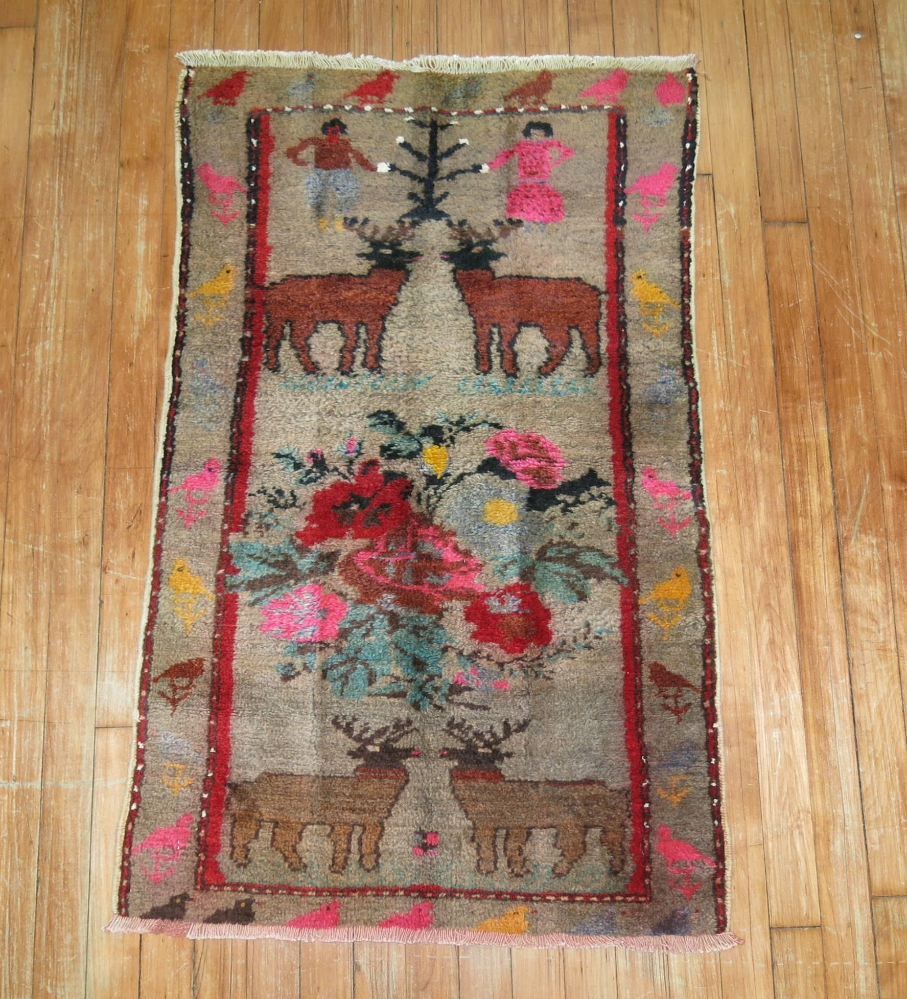 Eclectic Vintage Turkish Pictorial rug from the middle part of the 20th century.

2'2'' x 3'6''