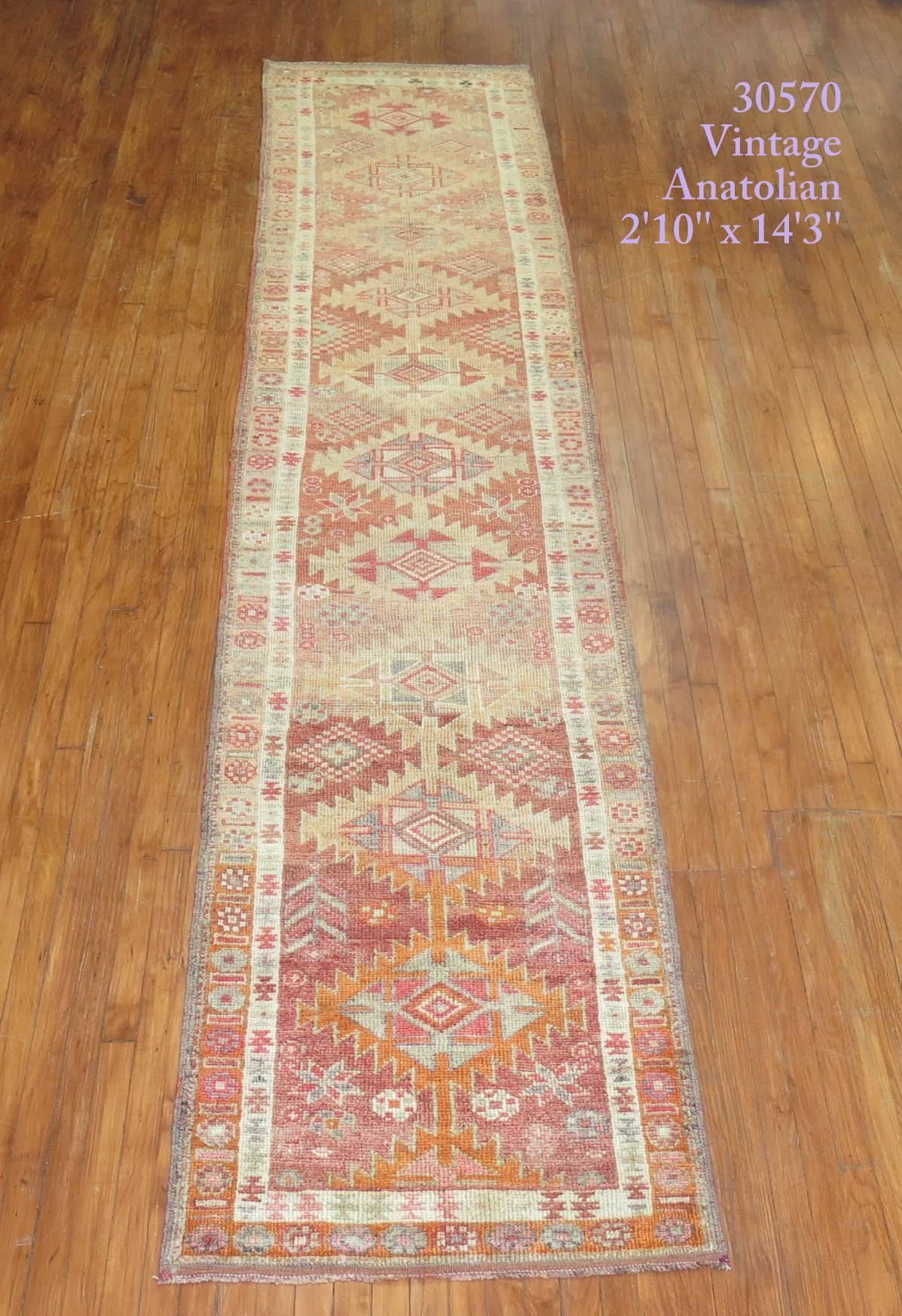 Lovely vintage Turkish Anaolian runner highlighted by pink and orange accents.