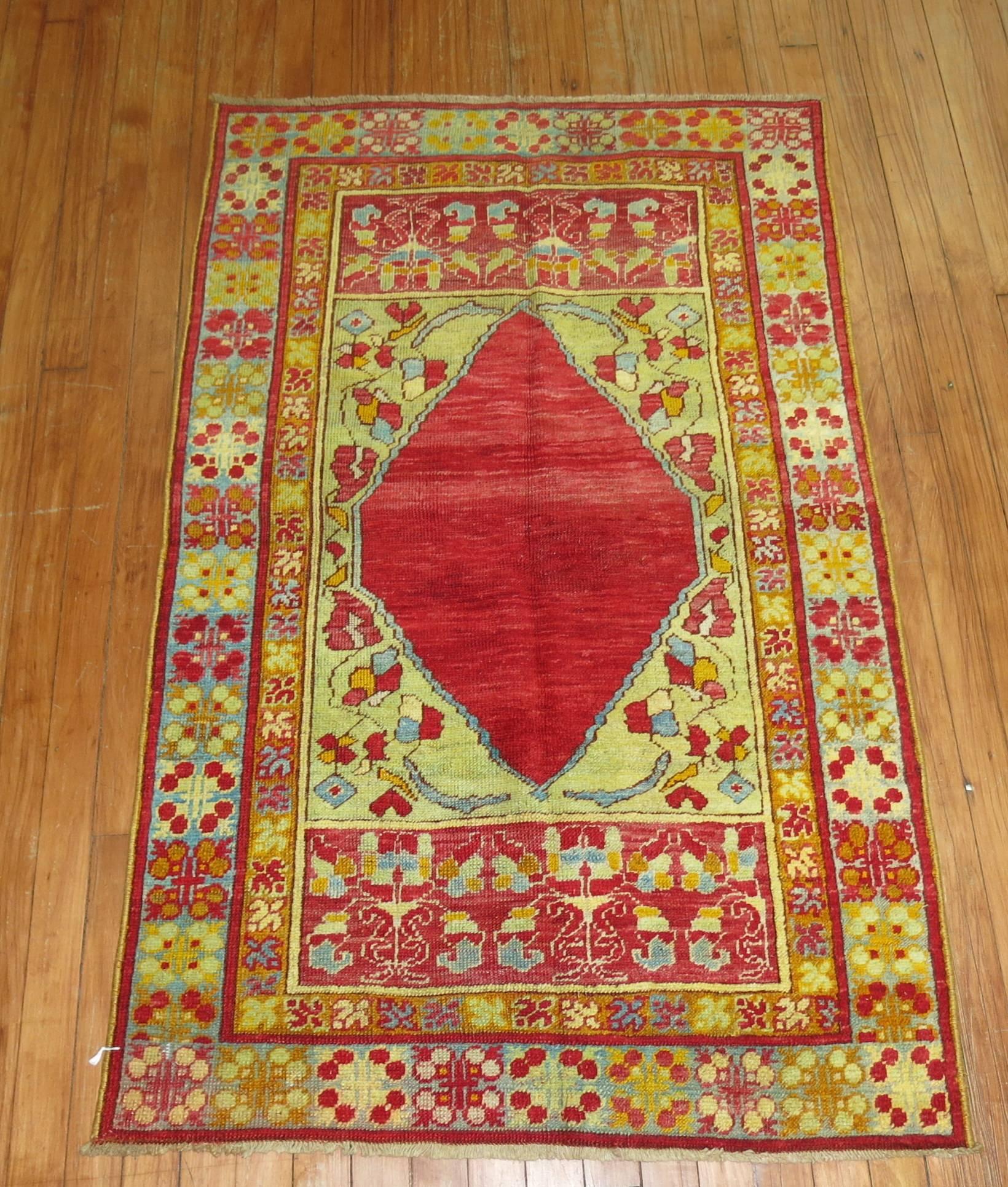 An early 20th century Turkish Melas rug featuring bright intense colors predominantly in cherry red and lime green.

Turkish rugs produced in the district of Melas are unique in their style, colors and composition. They are usually woven very
