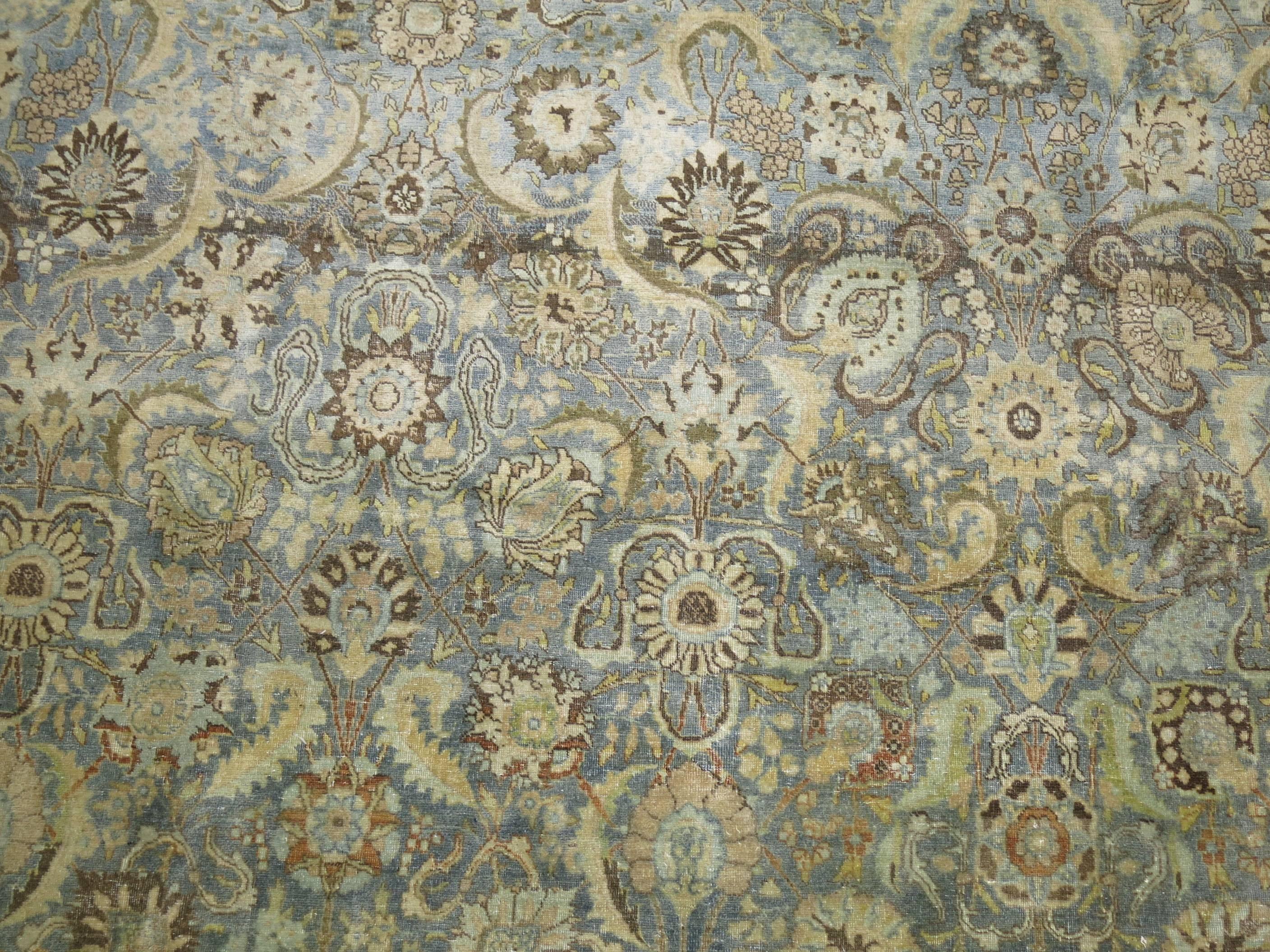 Stunning Persian Tabriz rug in soft blues and grey. The all-over palette has some lovely sand and brown accents.