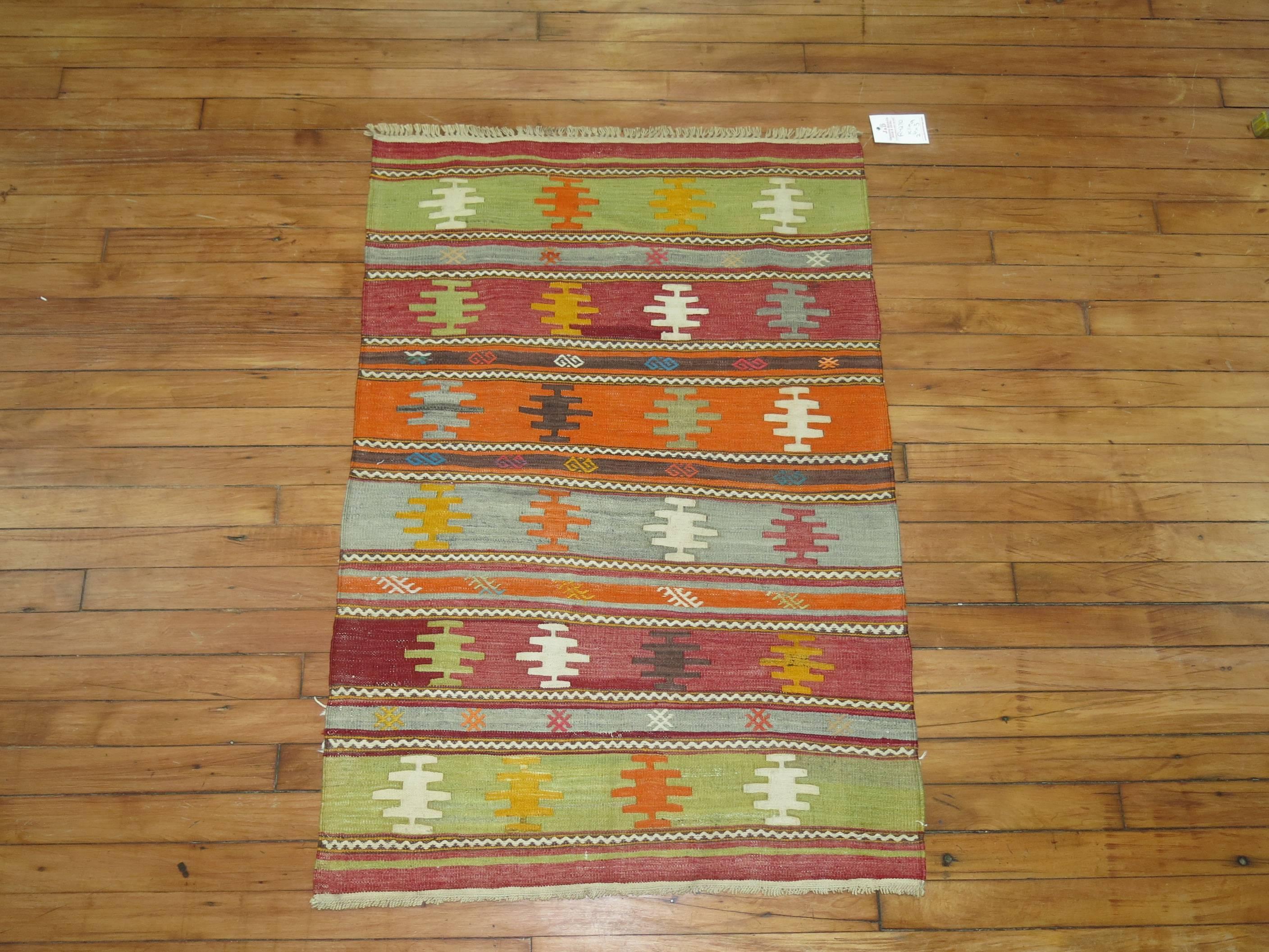 A vintage Turkish Kilim scatter rug from the middle of the 20th century.