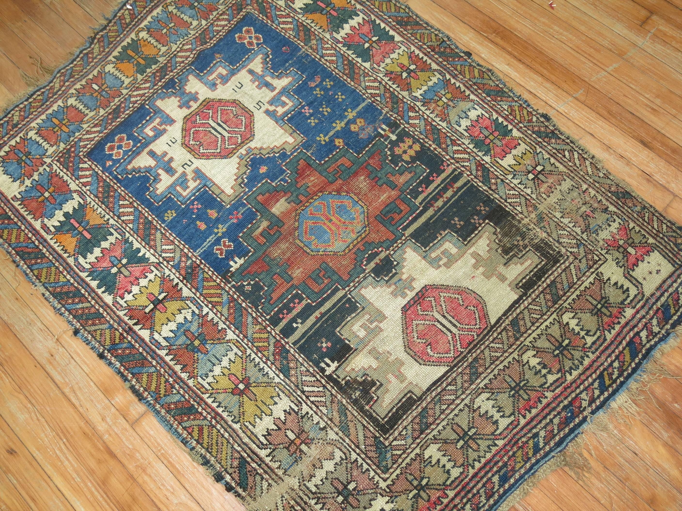 Worn 19th century Caucasian tribal rug.