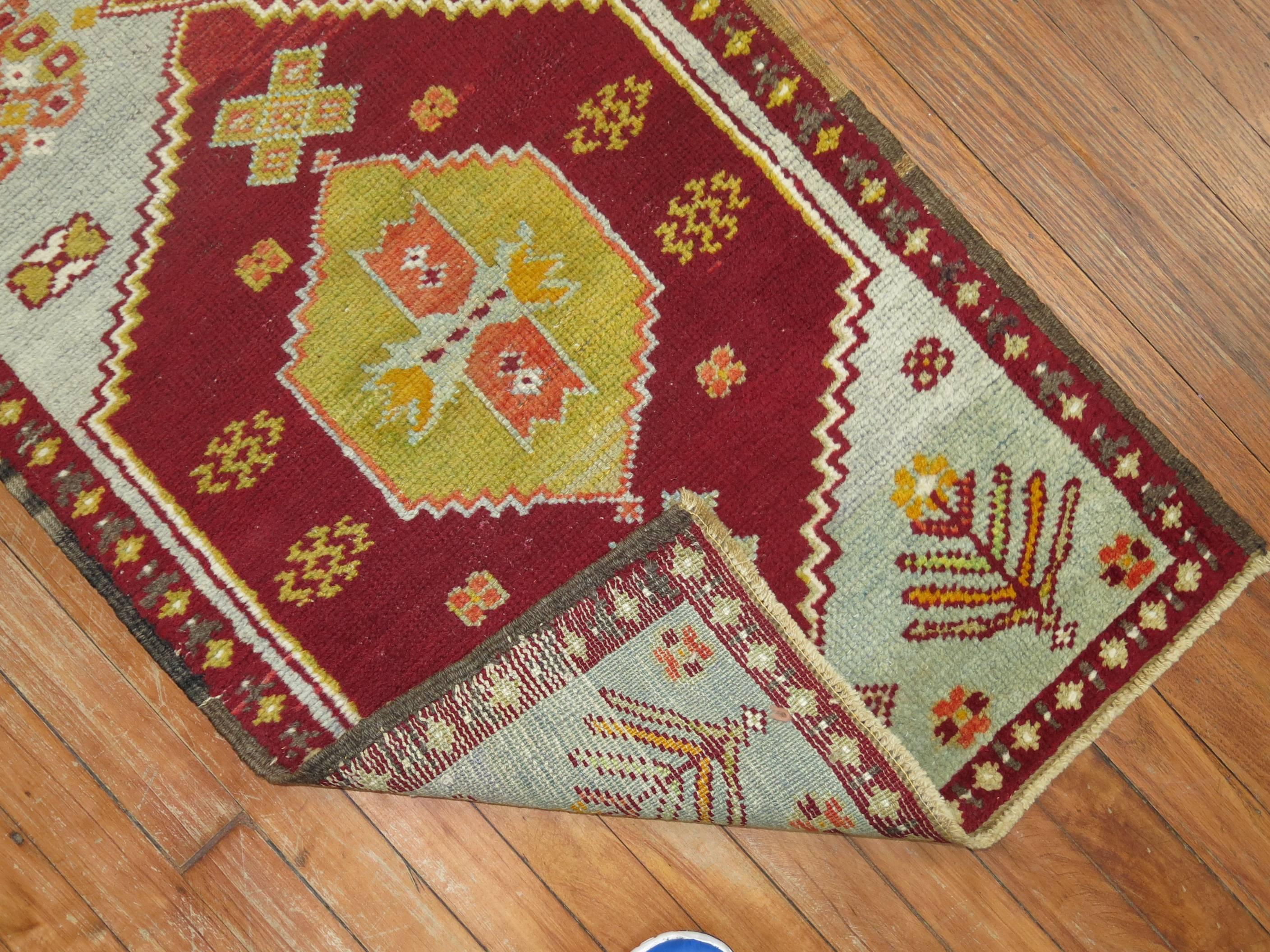 Narrow Turkish Sivas runner with icy blue field and deep reds.