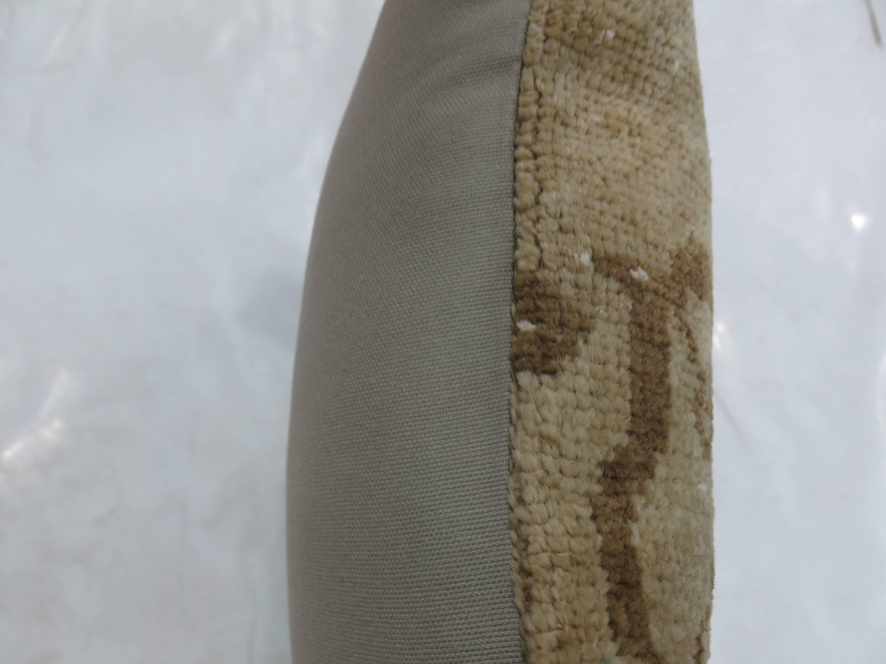 Pillow made from a Turkish Oushak rug in beige and brown.

18'' x 18''