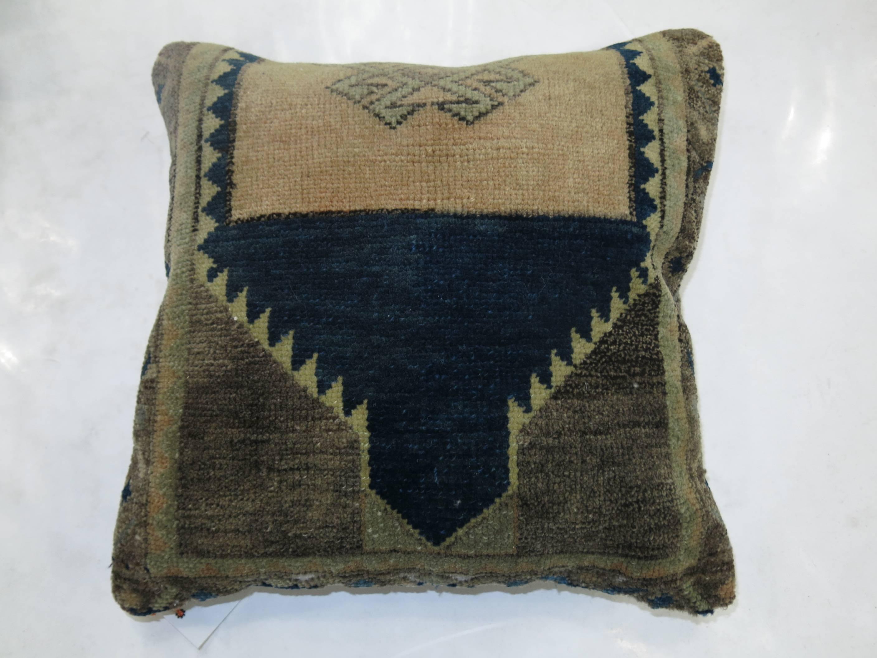 Pillows made from a set of Turkish rugs in beige, blue, green and tan accents. Measuring 17” x 18” & 16” x 16” respectively.