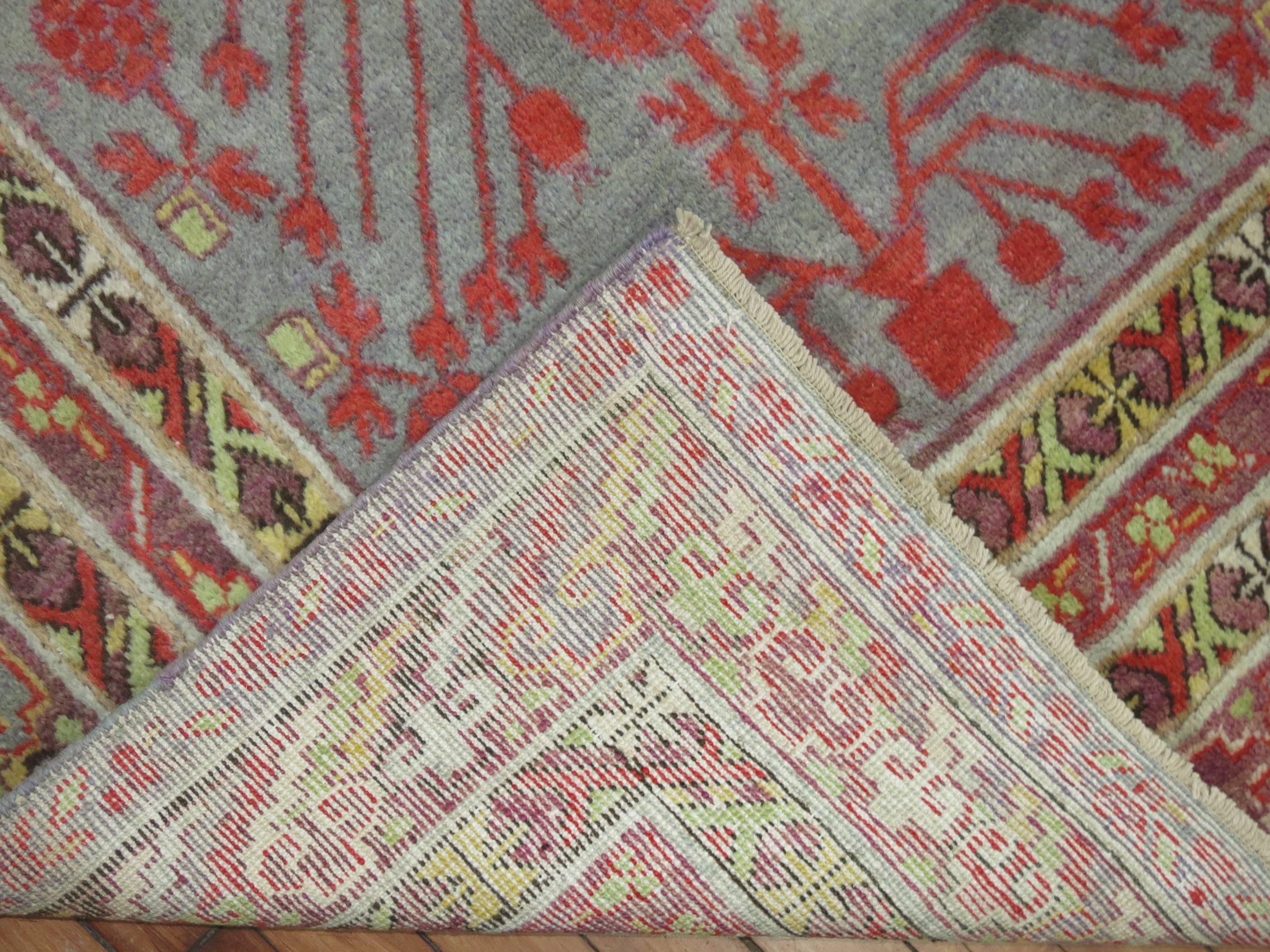 Wool Early 20th Century Khotan Gray Field Red Pomegranate Full Pile Rug In Excellent Condition For Sale In New York, NY