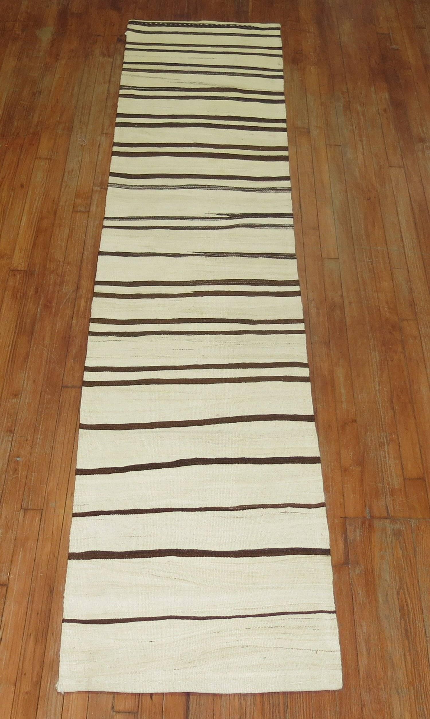 Narrow Kilim Runner from the middle of the 20th century in white and brown.