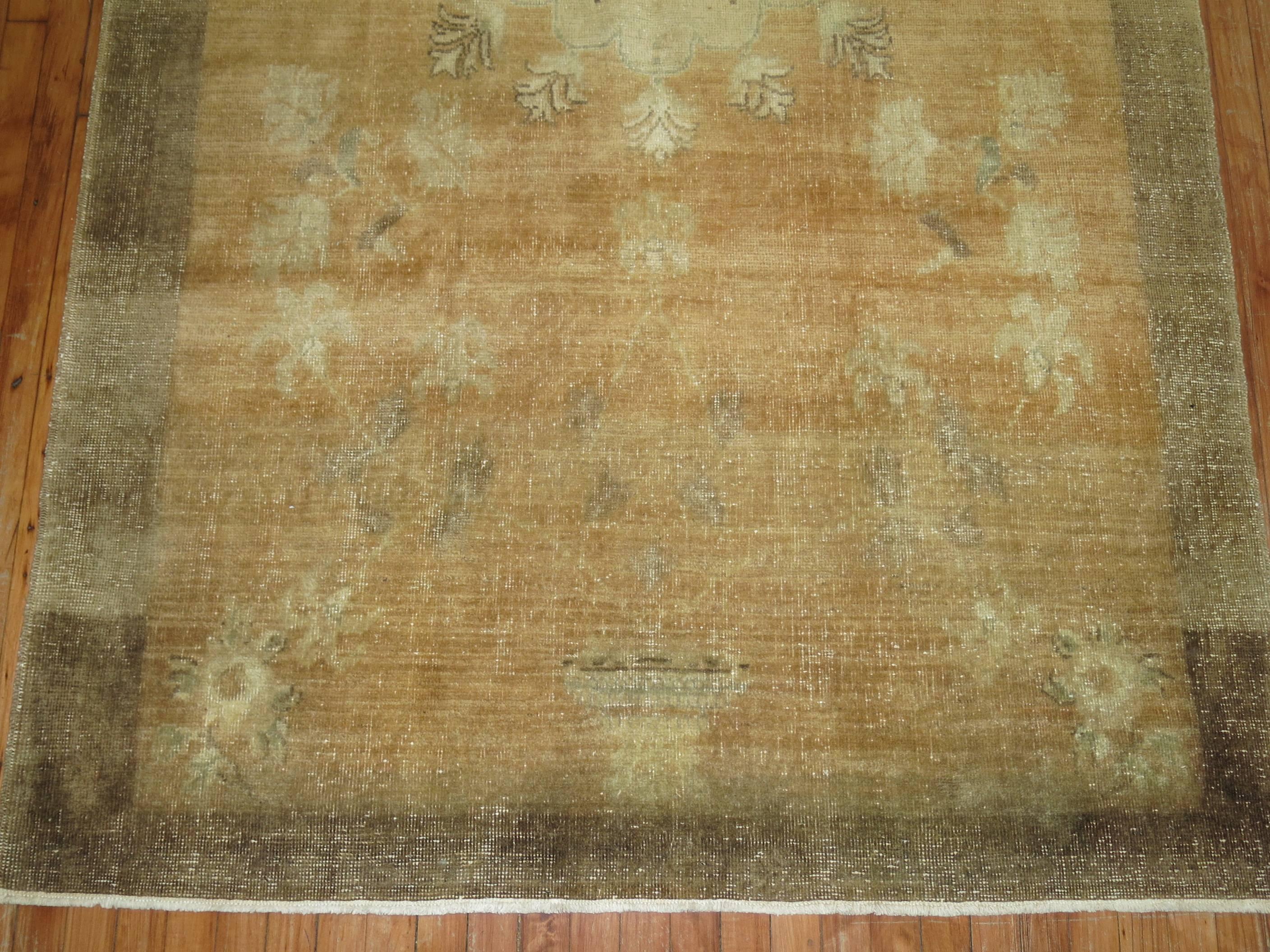 A vintage Turkish gallery size rug in browns and camel.