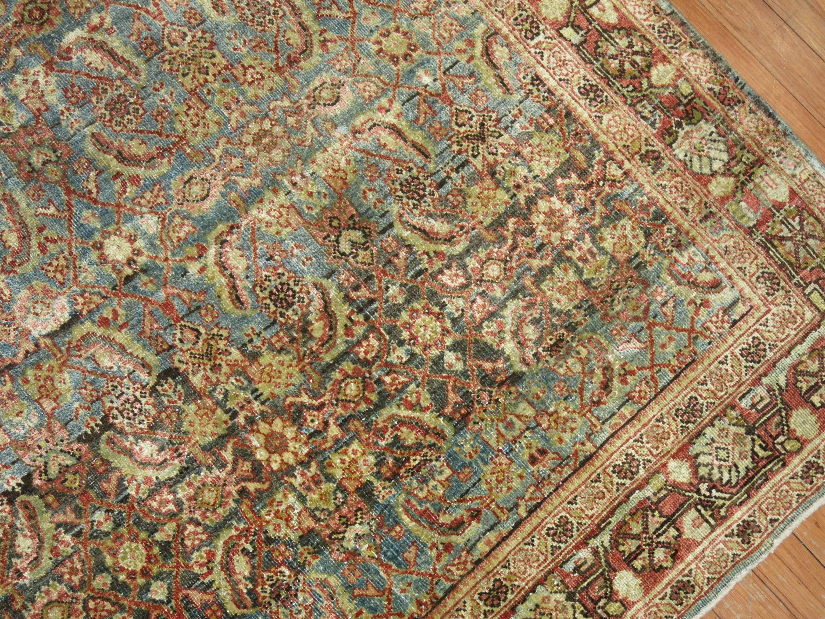 An exquisite antique Persian Mahal rug with an all-over predominant blue/gray abrashed field. Highly decorative and a timeless pattern that can be used in any type of setting.

4'3'' x 6'6''
