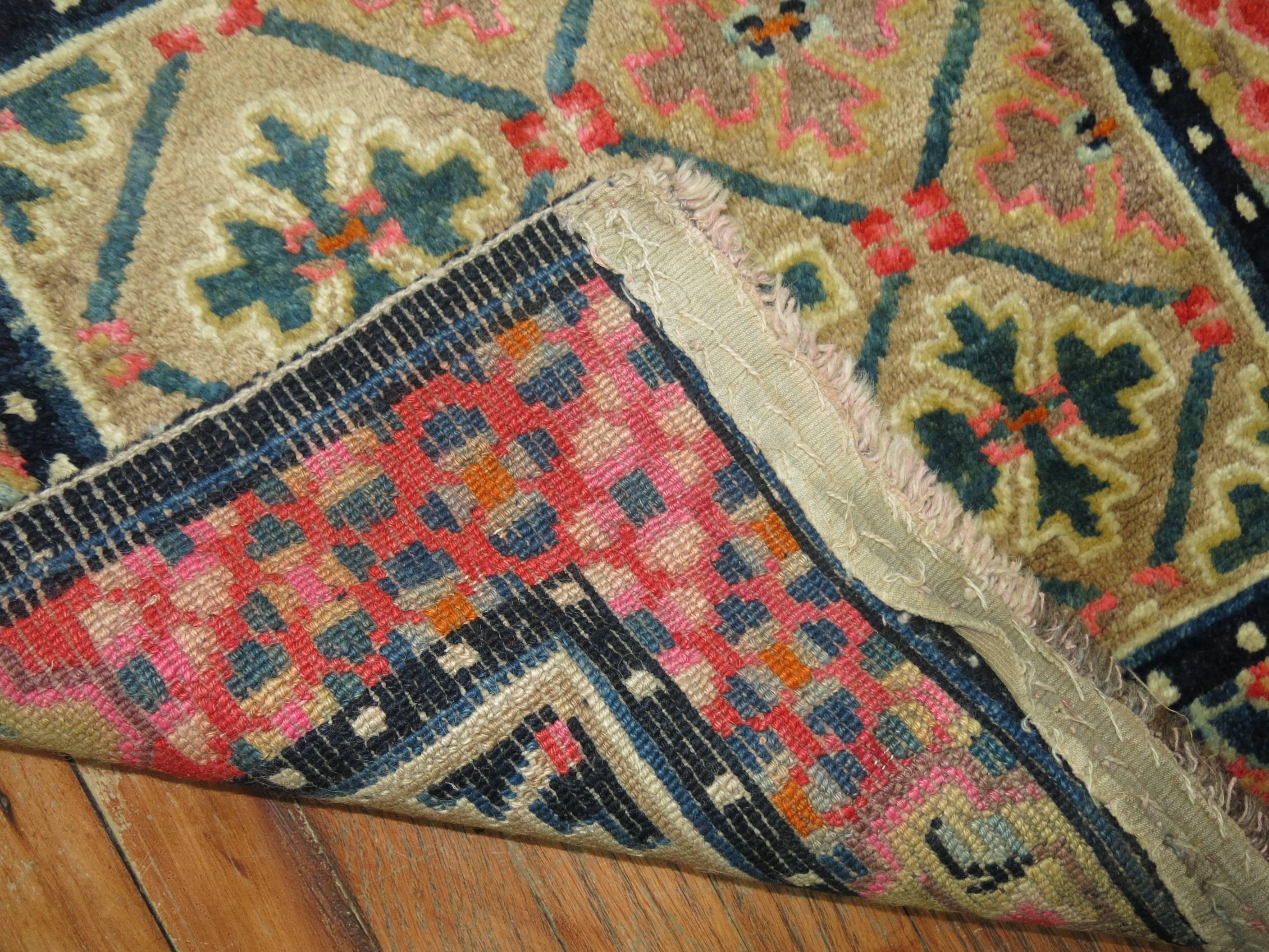 A pair of antique Tibetan rug mats measuring 24