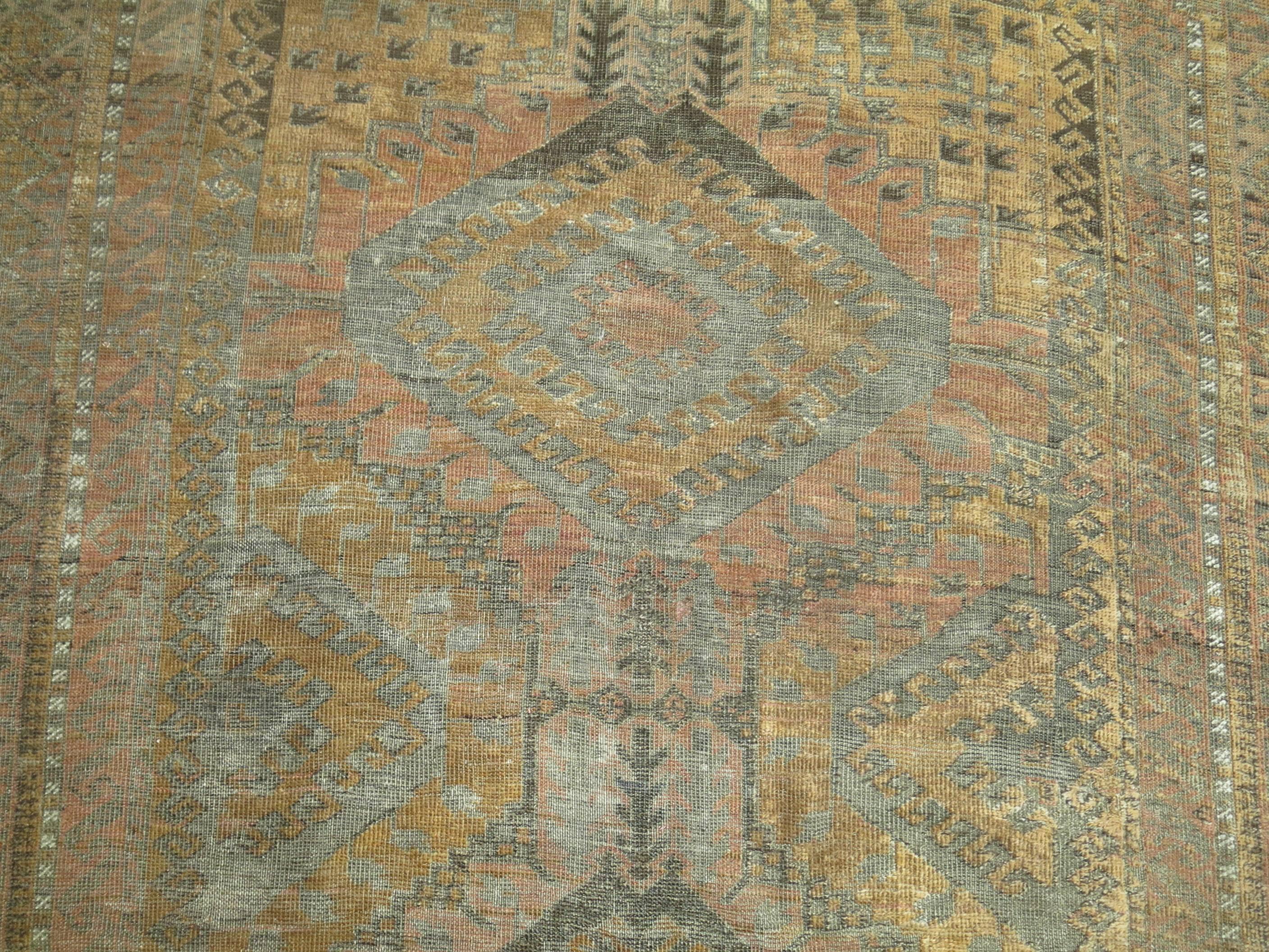 Pale brown, copper and caramel color Persian Balouch carpet from the early 20th century.

Measures: 5'7