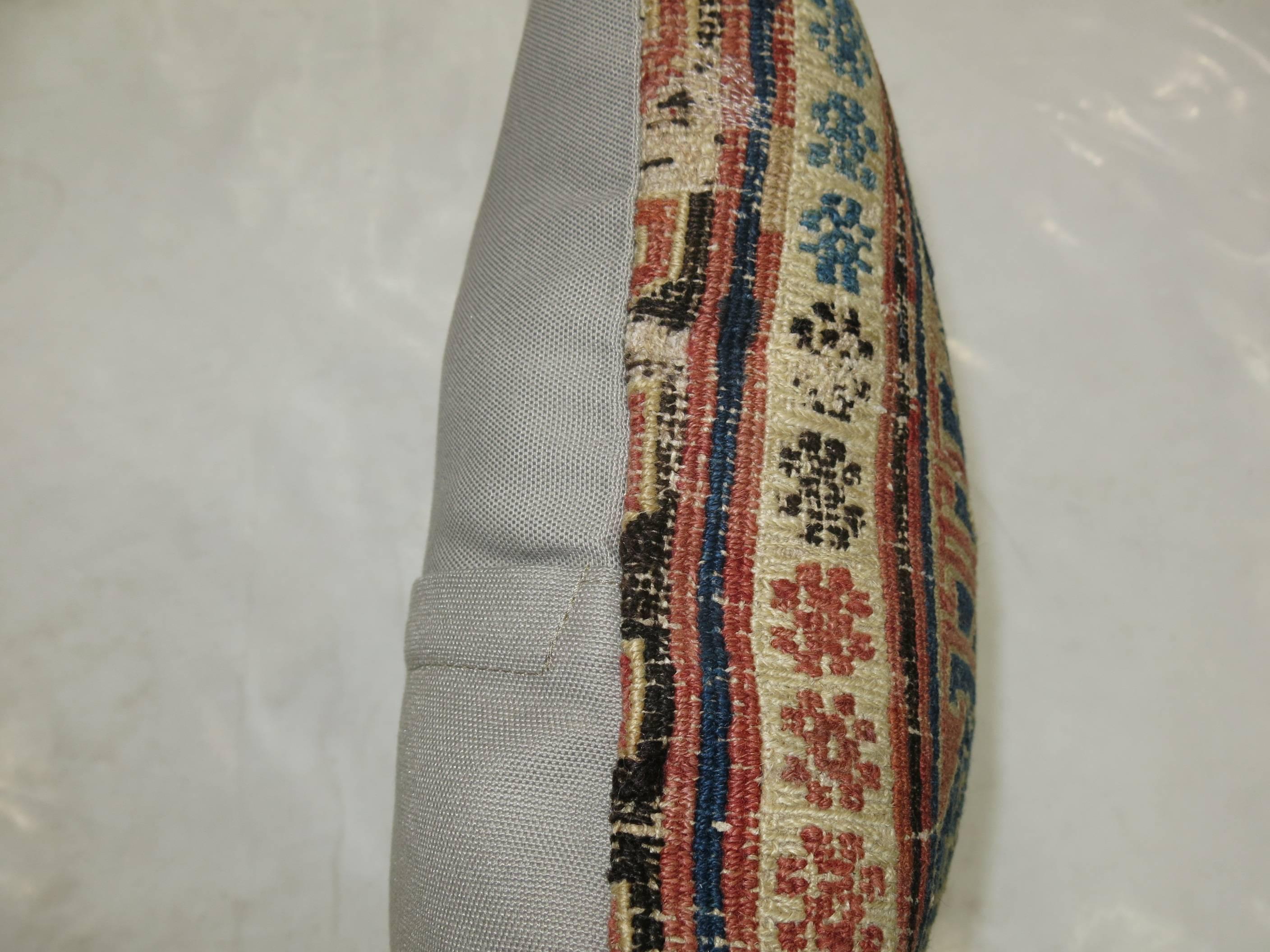 Pillow made from an 18th century Soumak flat-weave rug.