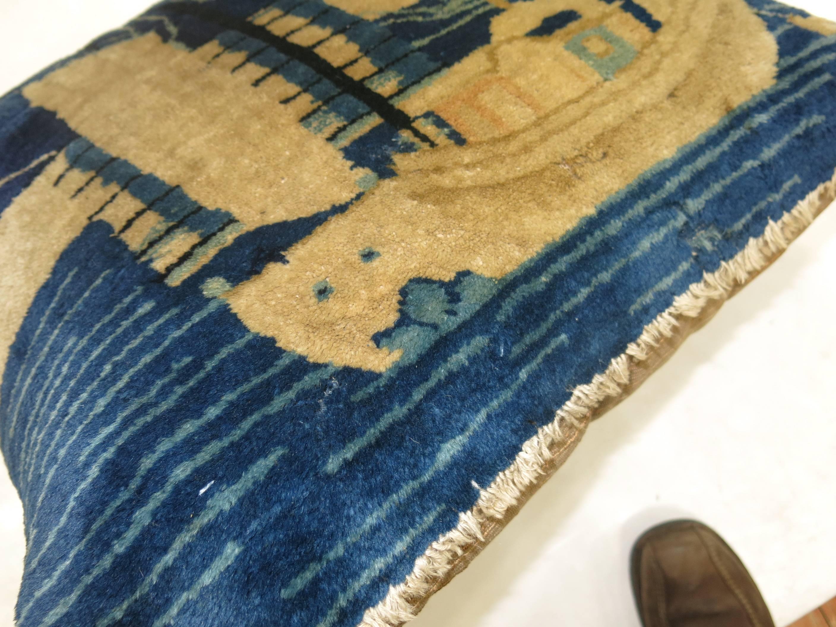 An enchanting pillow made from an early 20th century Chinese Peking rug depicting a sailboat. Sewn shut backed in cotton with fringes. 

Measures: 24