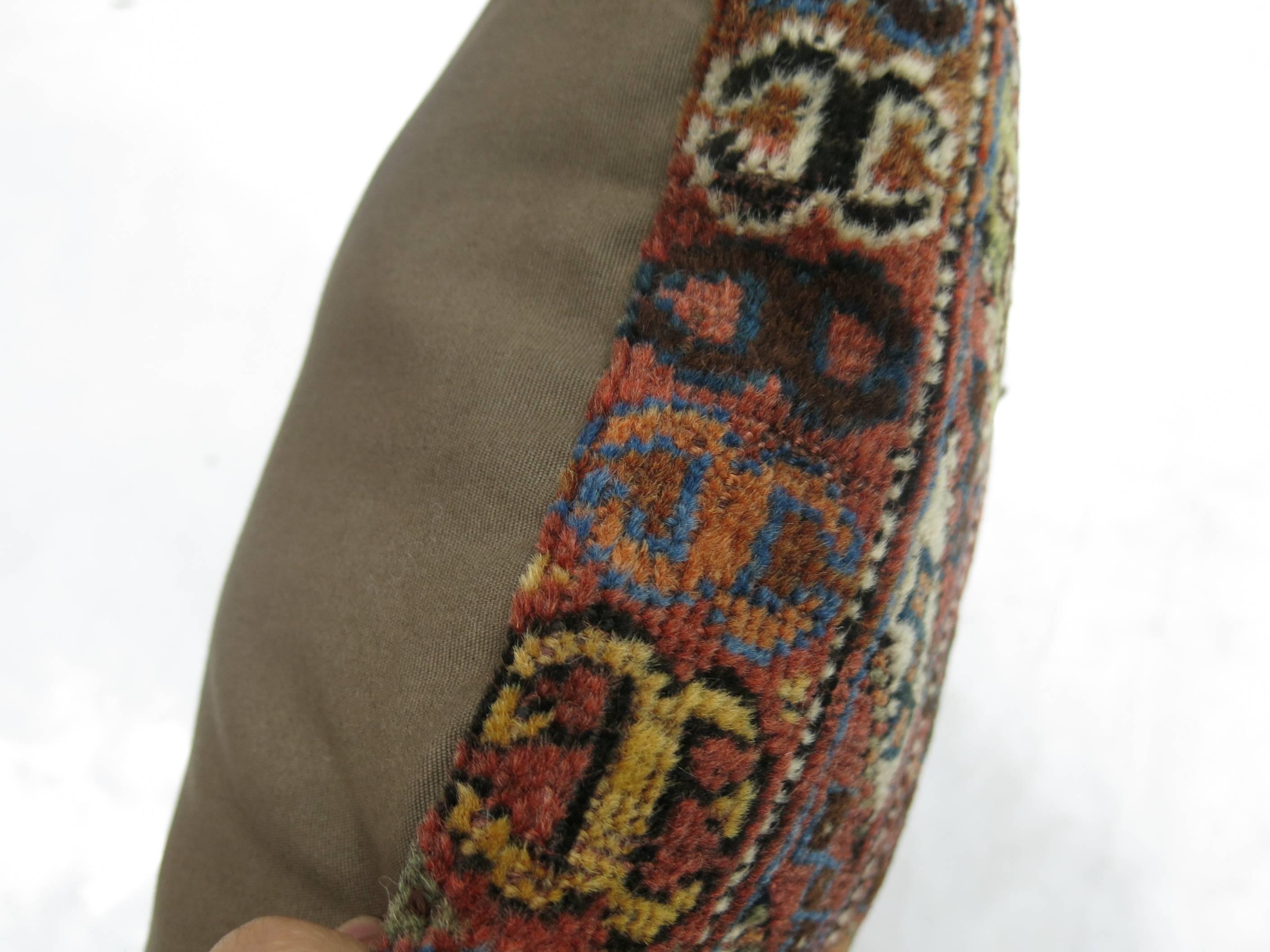 Pillow made from a tribal Persian Rug.