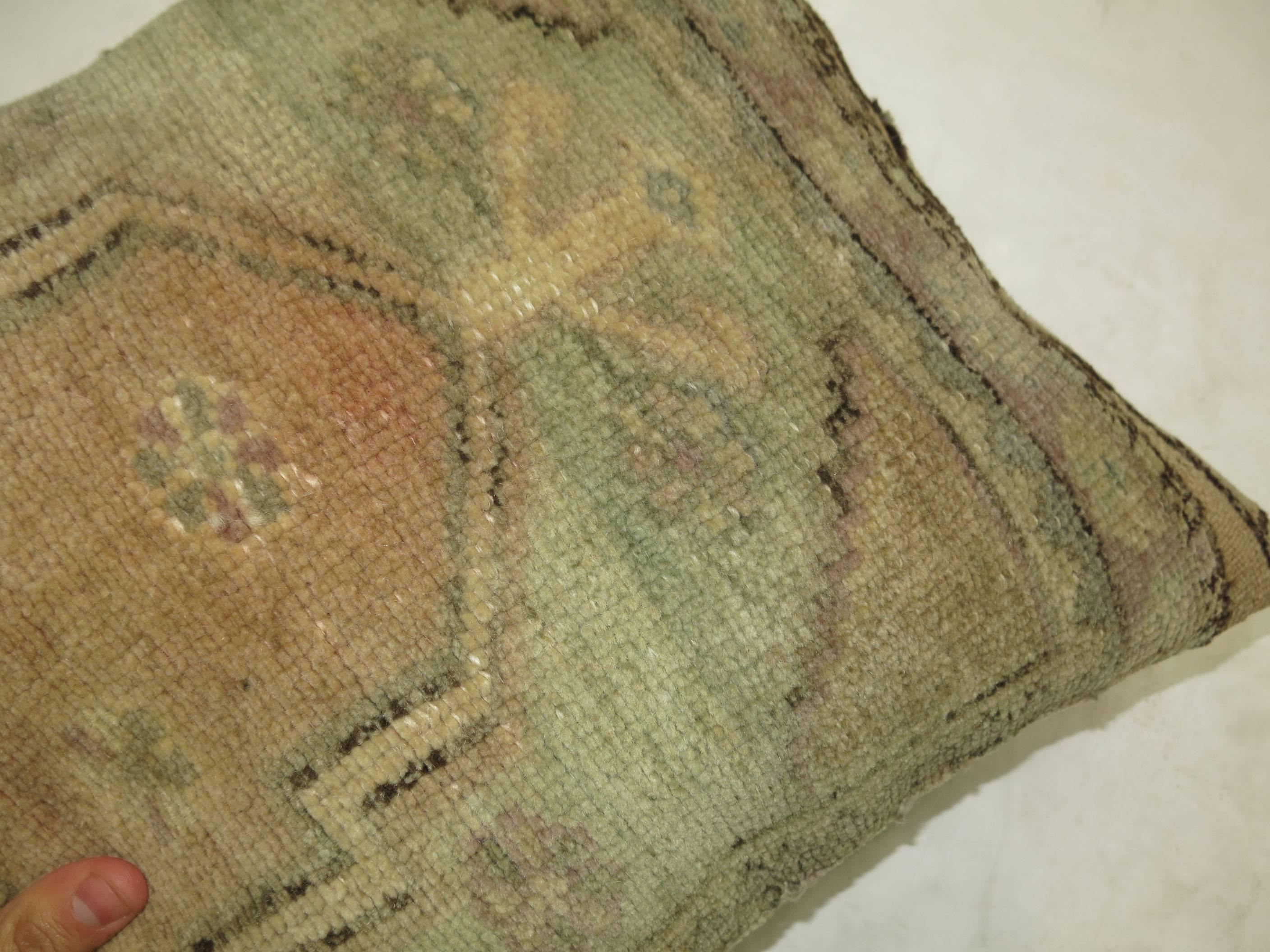 Pillow made from a vintage Turkish Oushak rug.