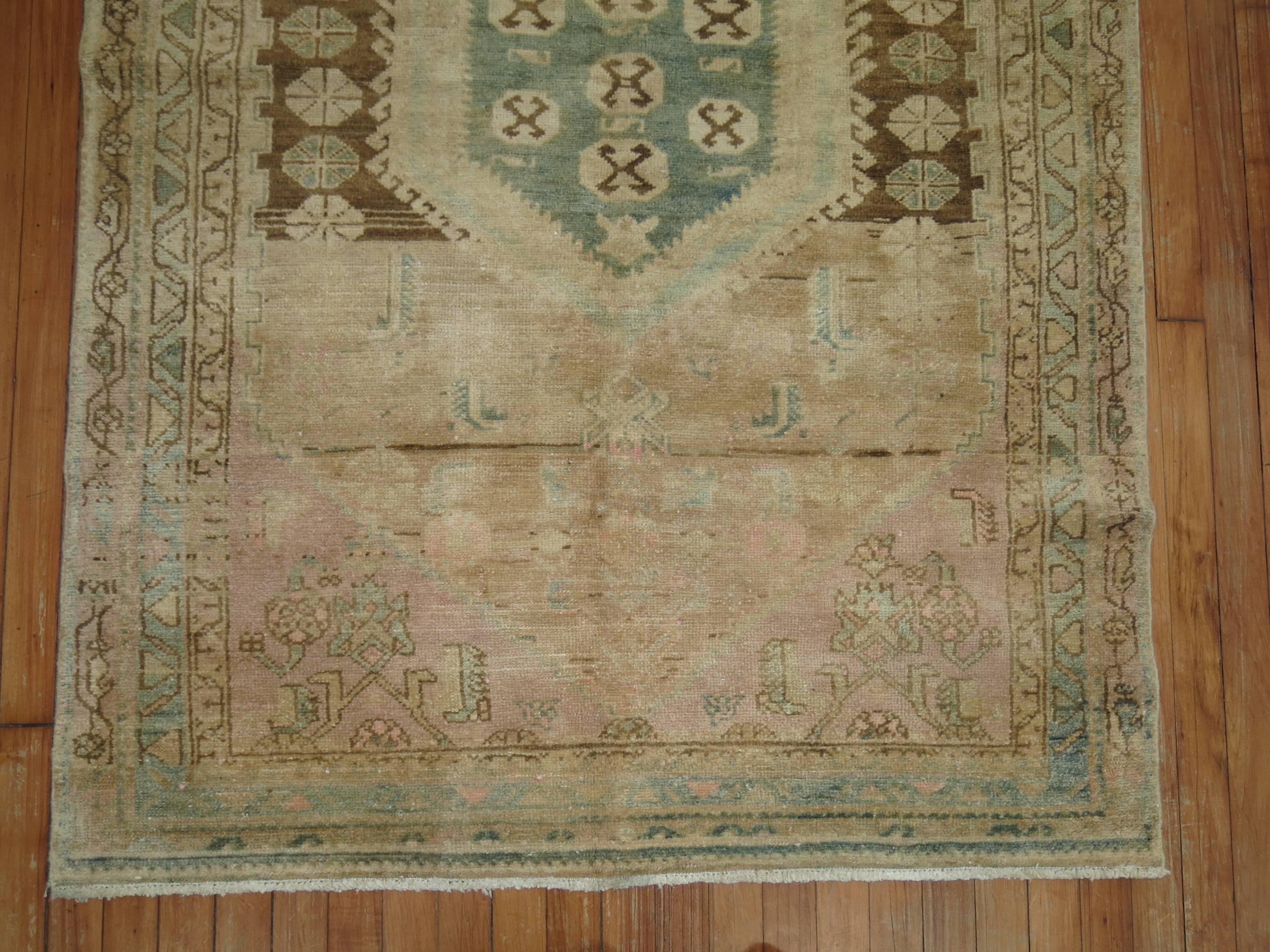 One of a kind vintage Persian Hamedan rug in pastel tones. One end has a soft pink shade which gives it a unique feel.